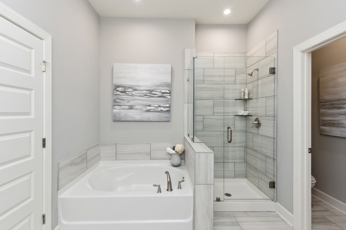 Primary bathroom with large walk-in shower / Primary bathroom with shower and garden tub