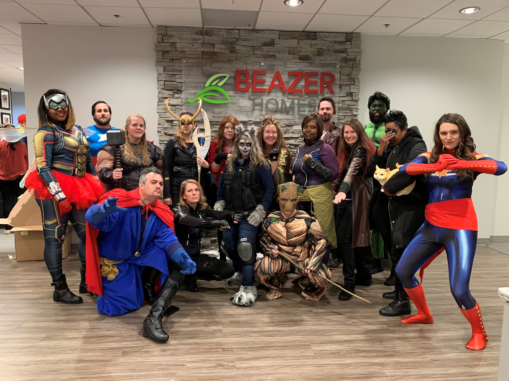 HR department dressed up as superheroes for Halloween