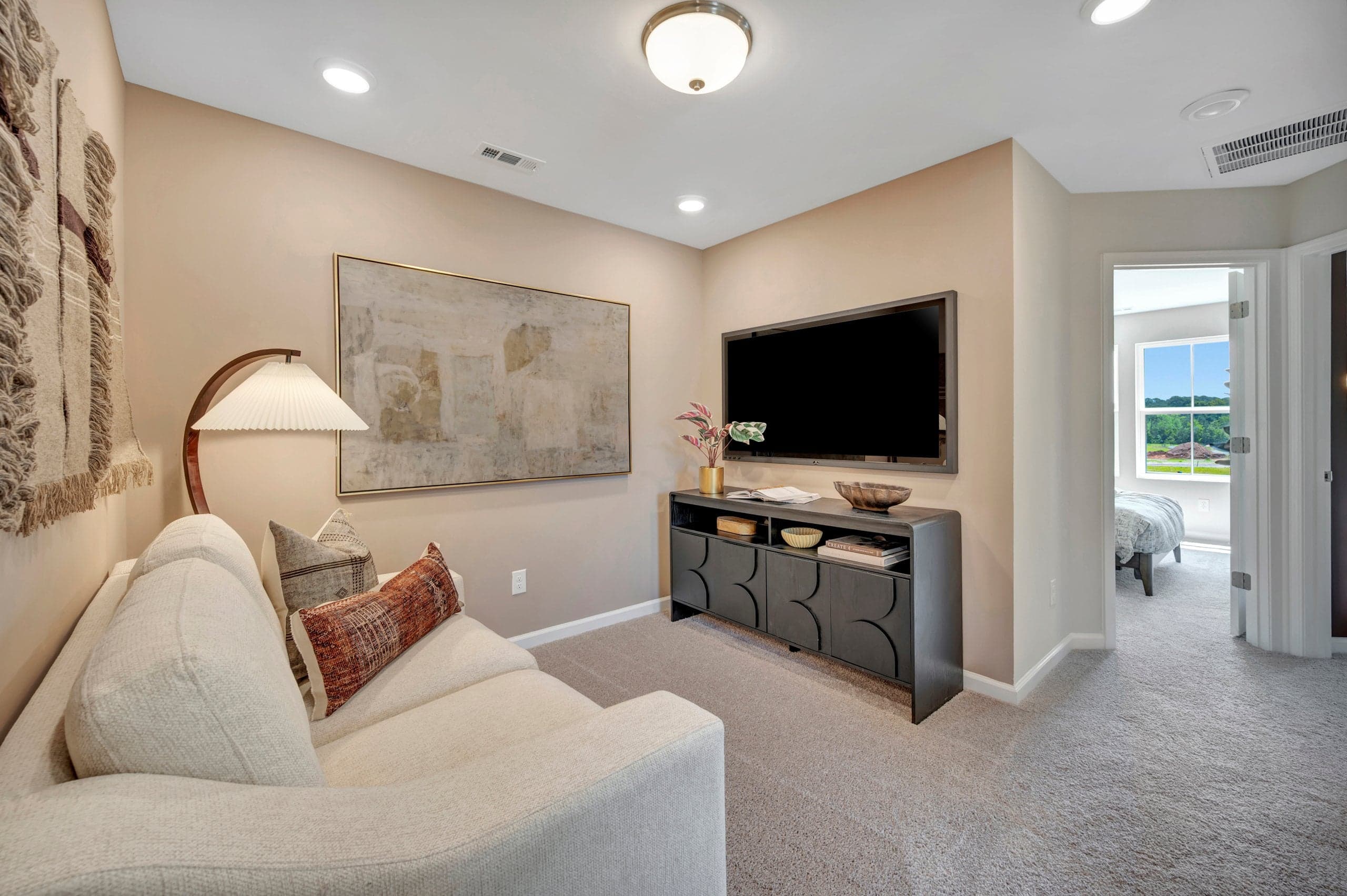 loft with a mounted television