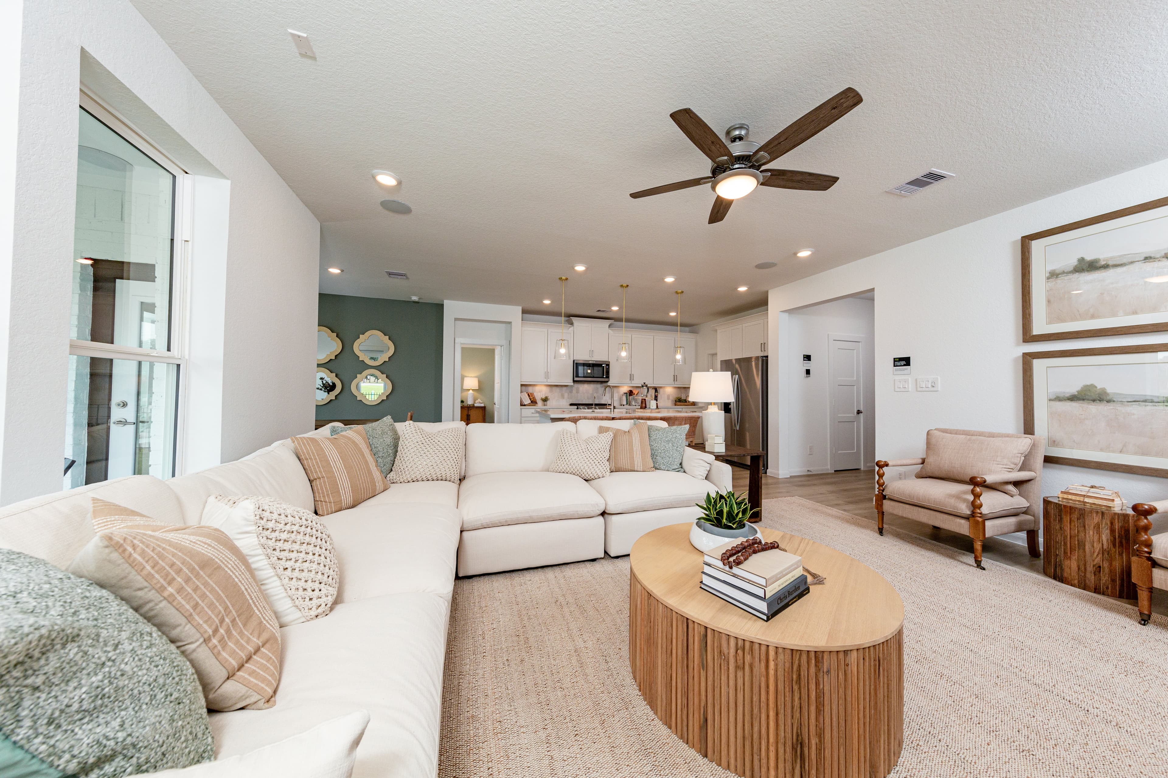 open great room with carpet and windows