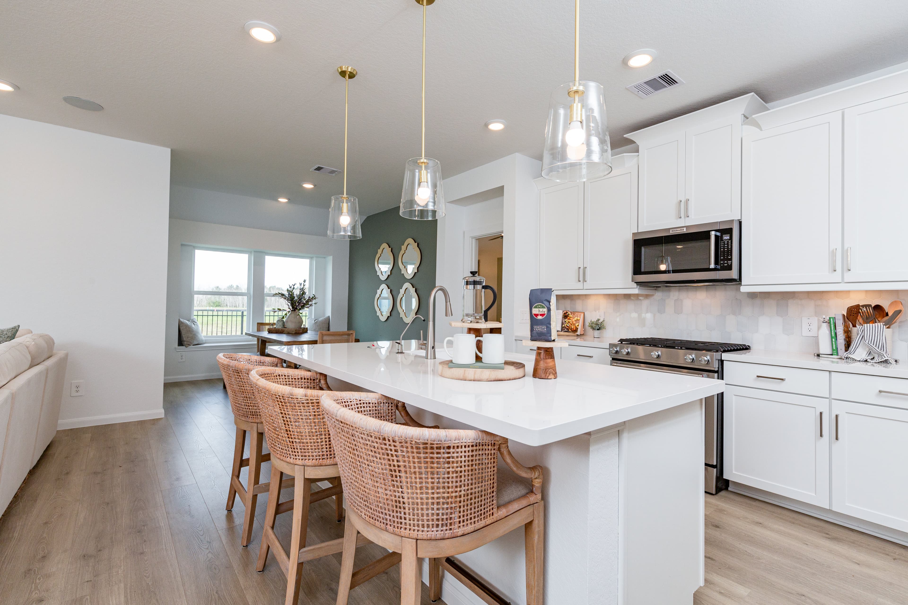 open kitchen with white cabinets