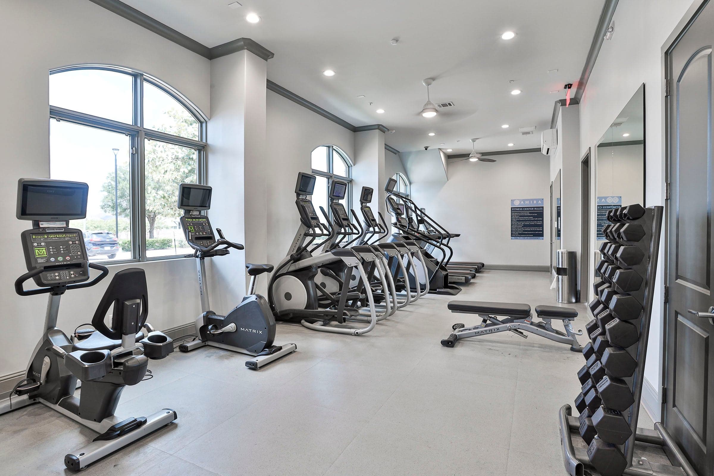 fitness center with weights and cardio equipment