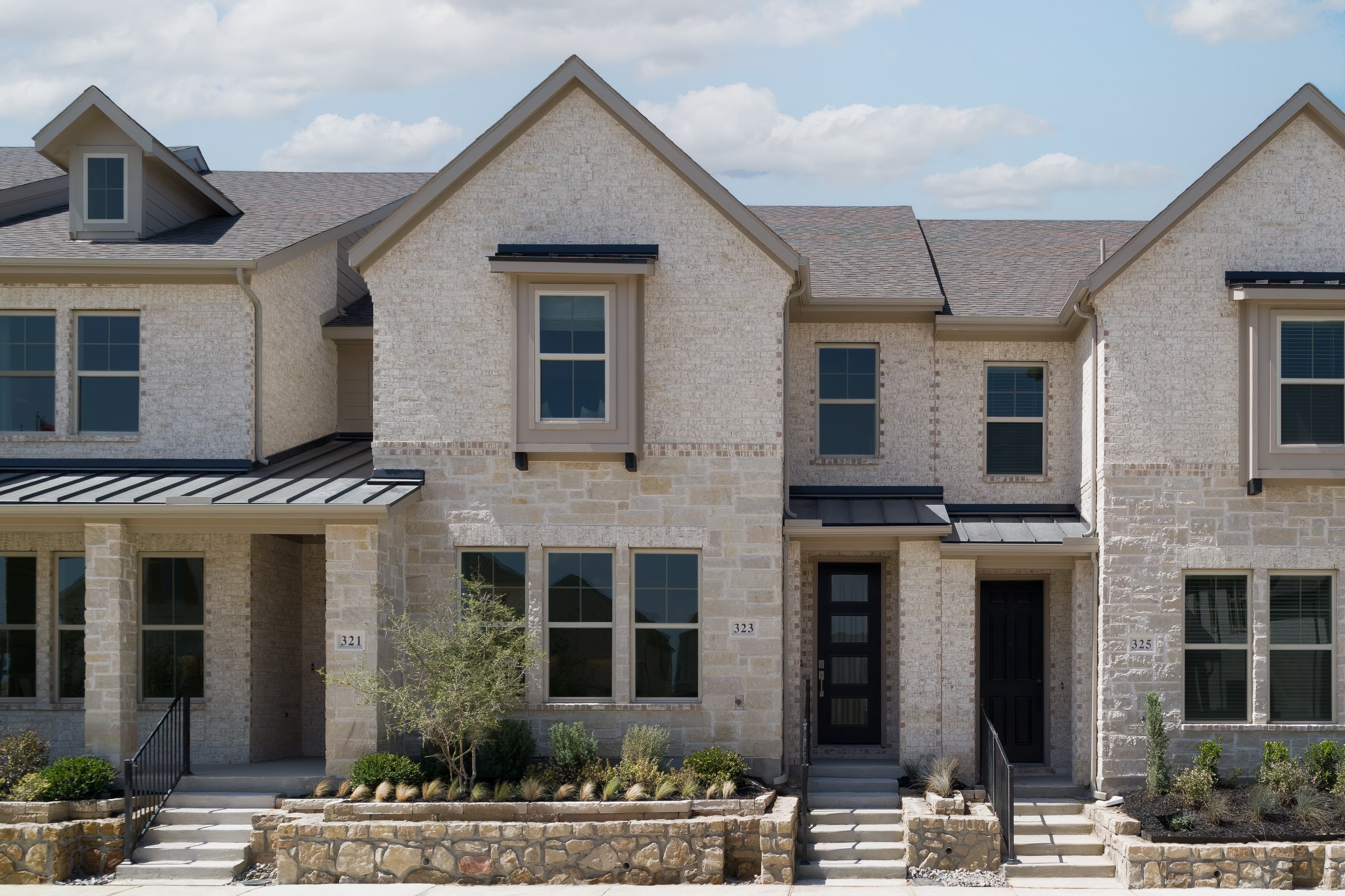 townhome with brick and stone exterior