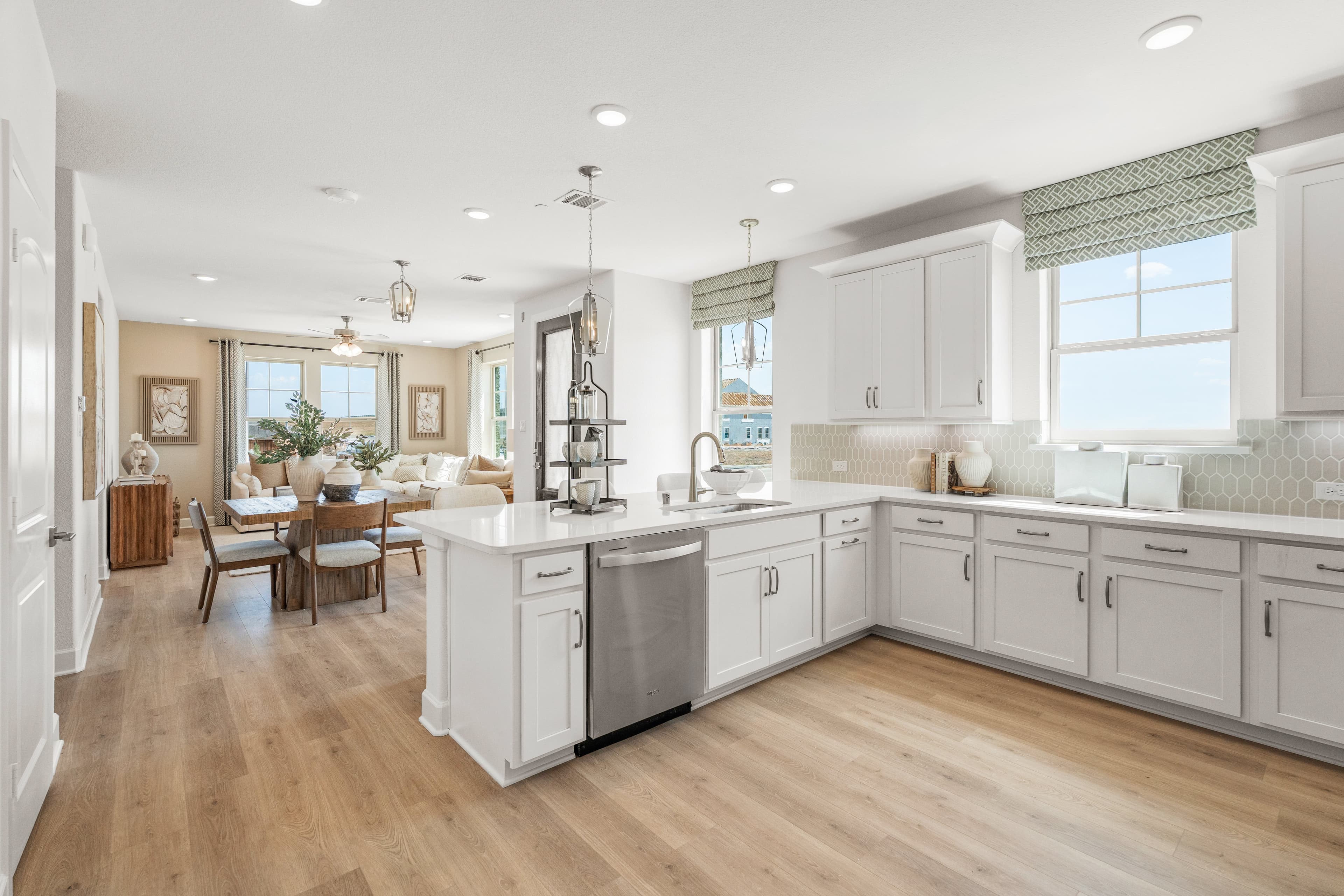 kitchen with white countertops and cabinets 