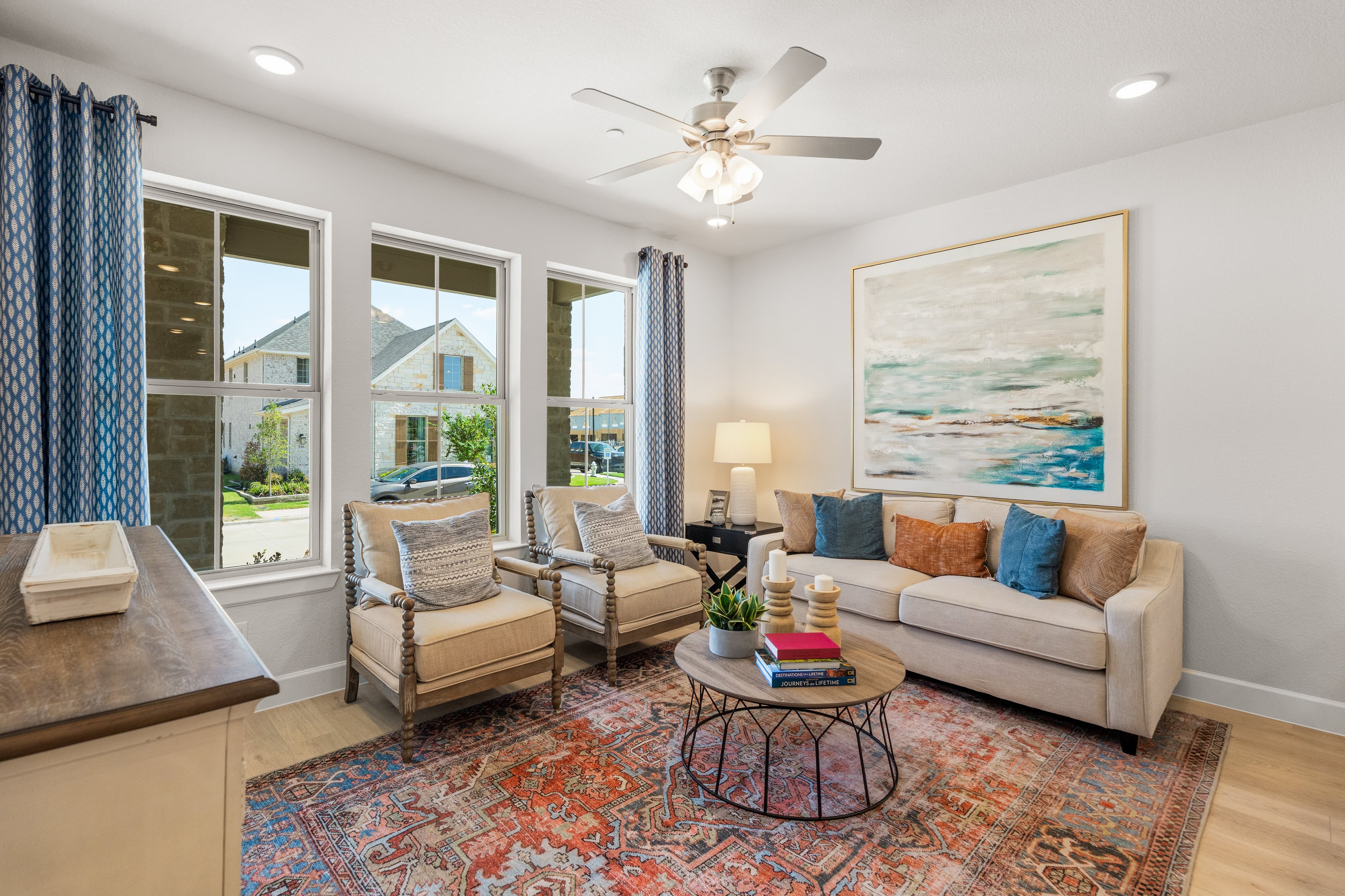 open great room with wood floors and windows