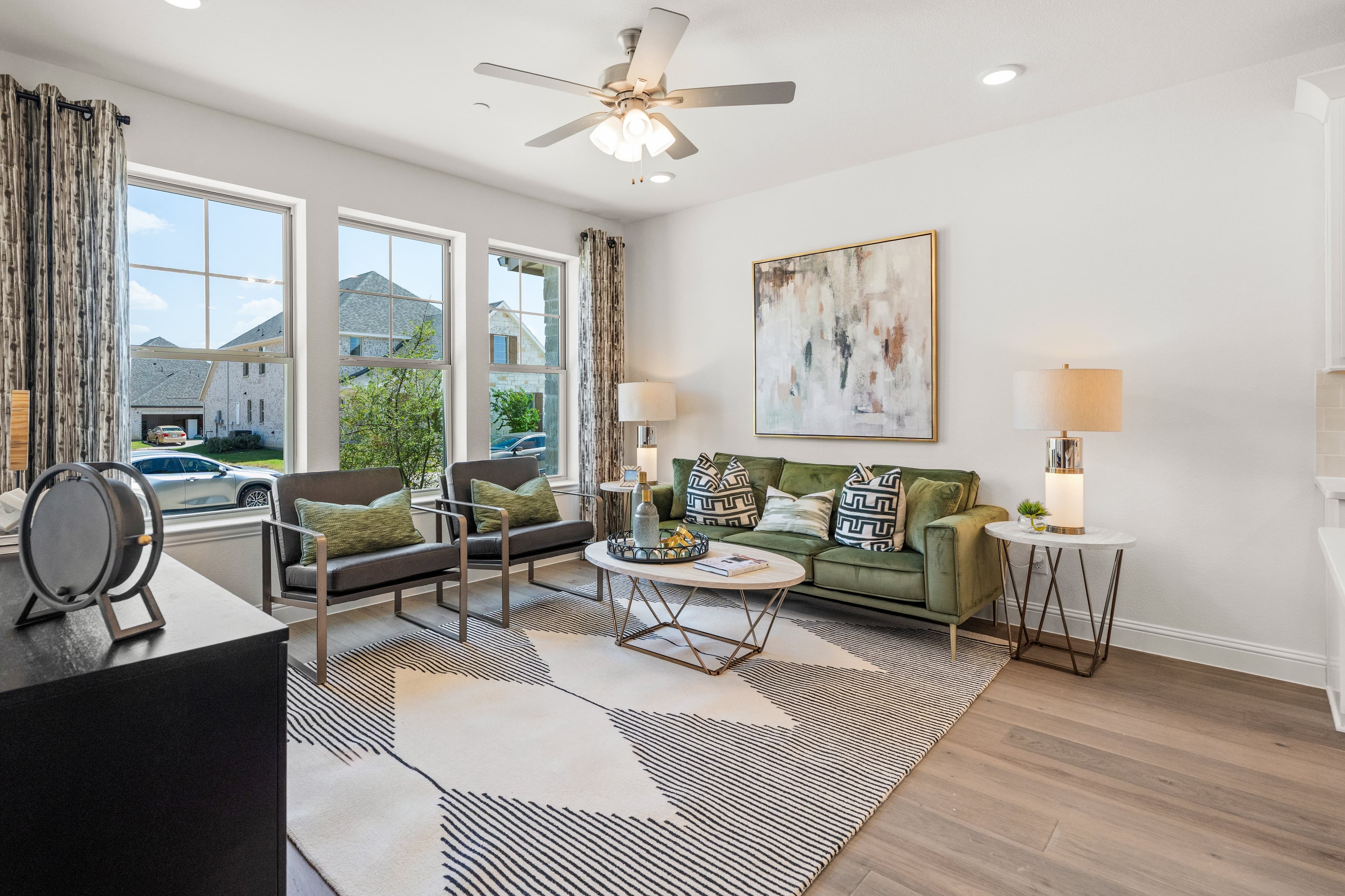 open great room with wood floors and windows