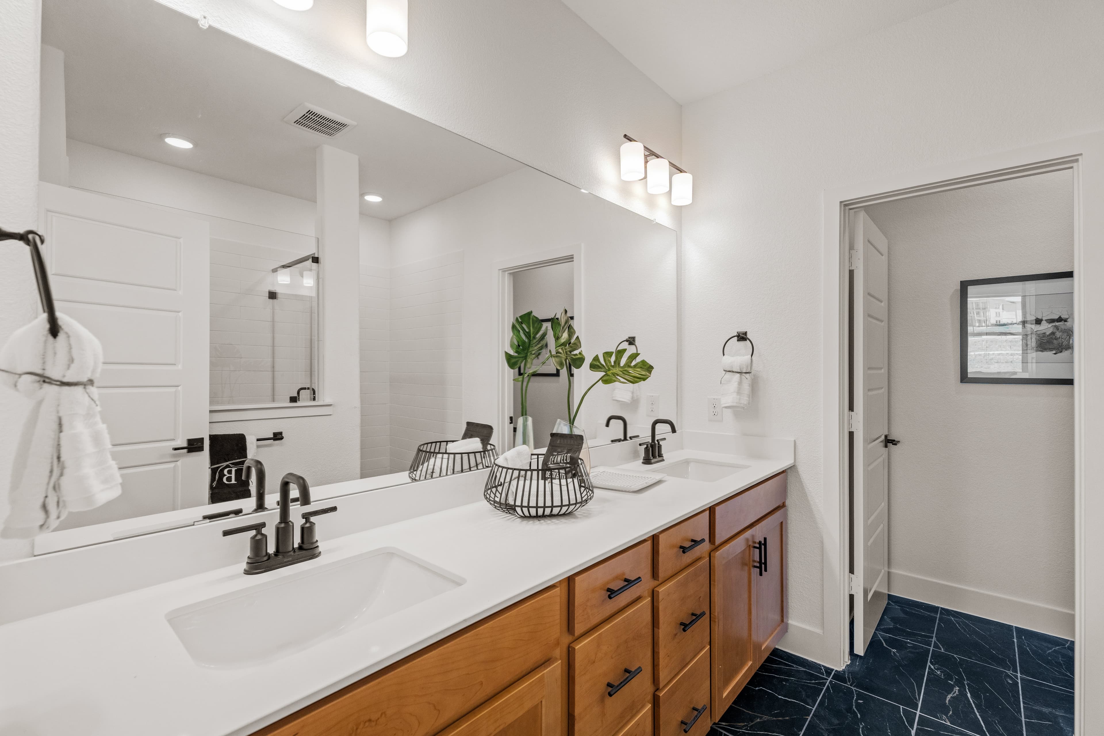bathroom with two sinks and white countertops 
