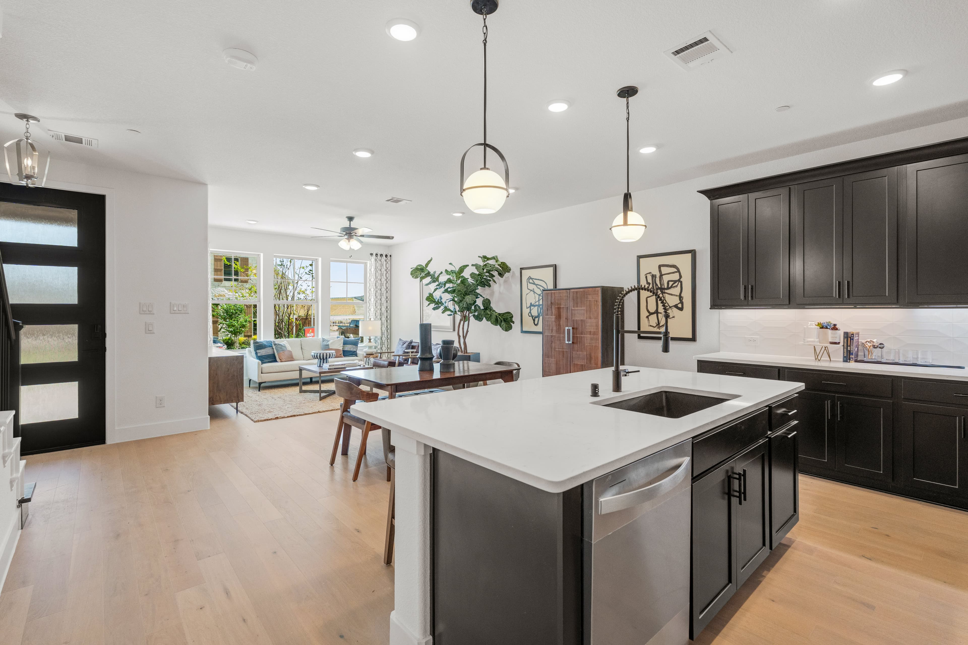 kitchen with black cabinets and white countertops 