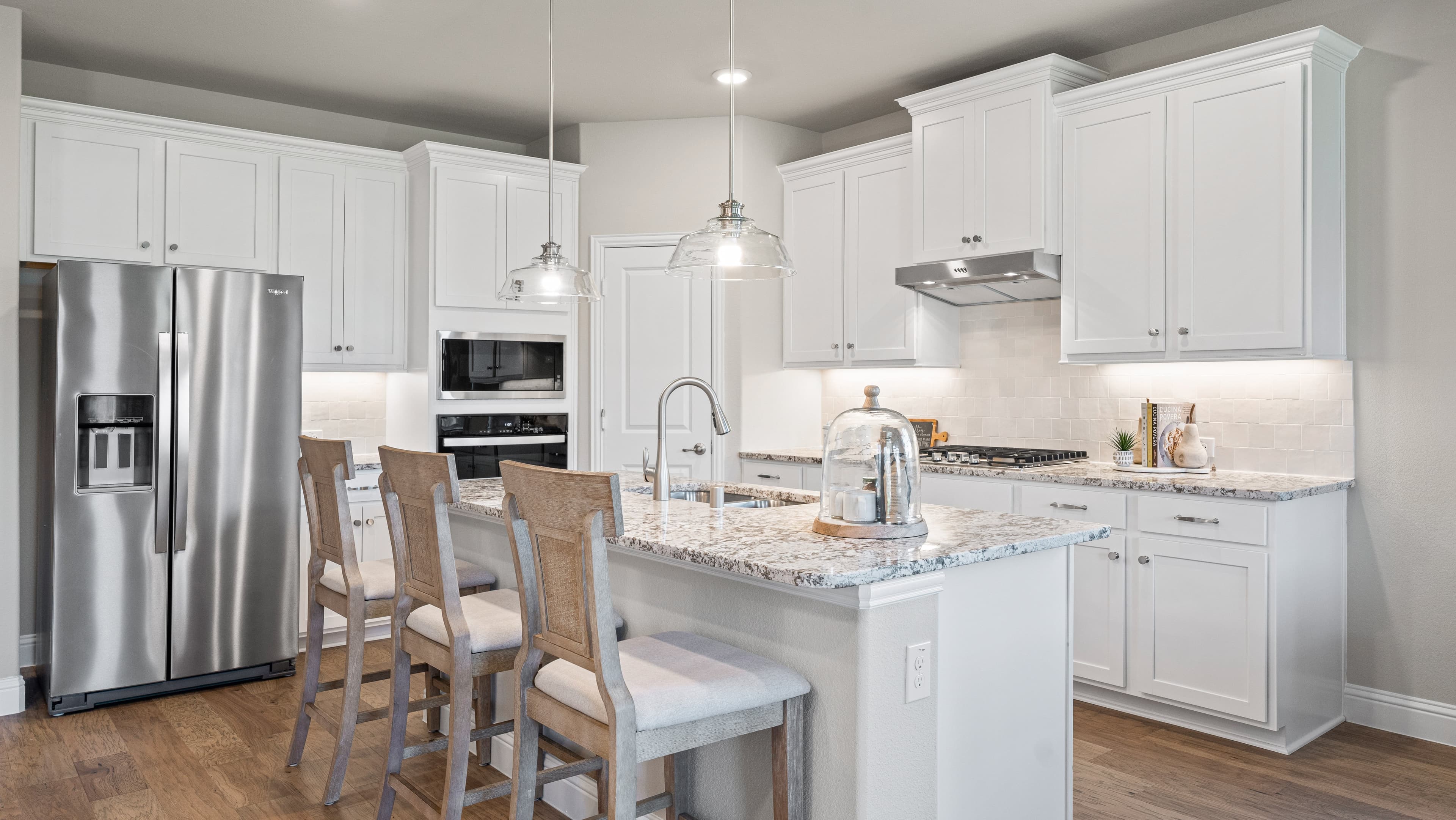 open kitchen with white cabinets