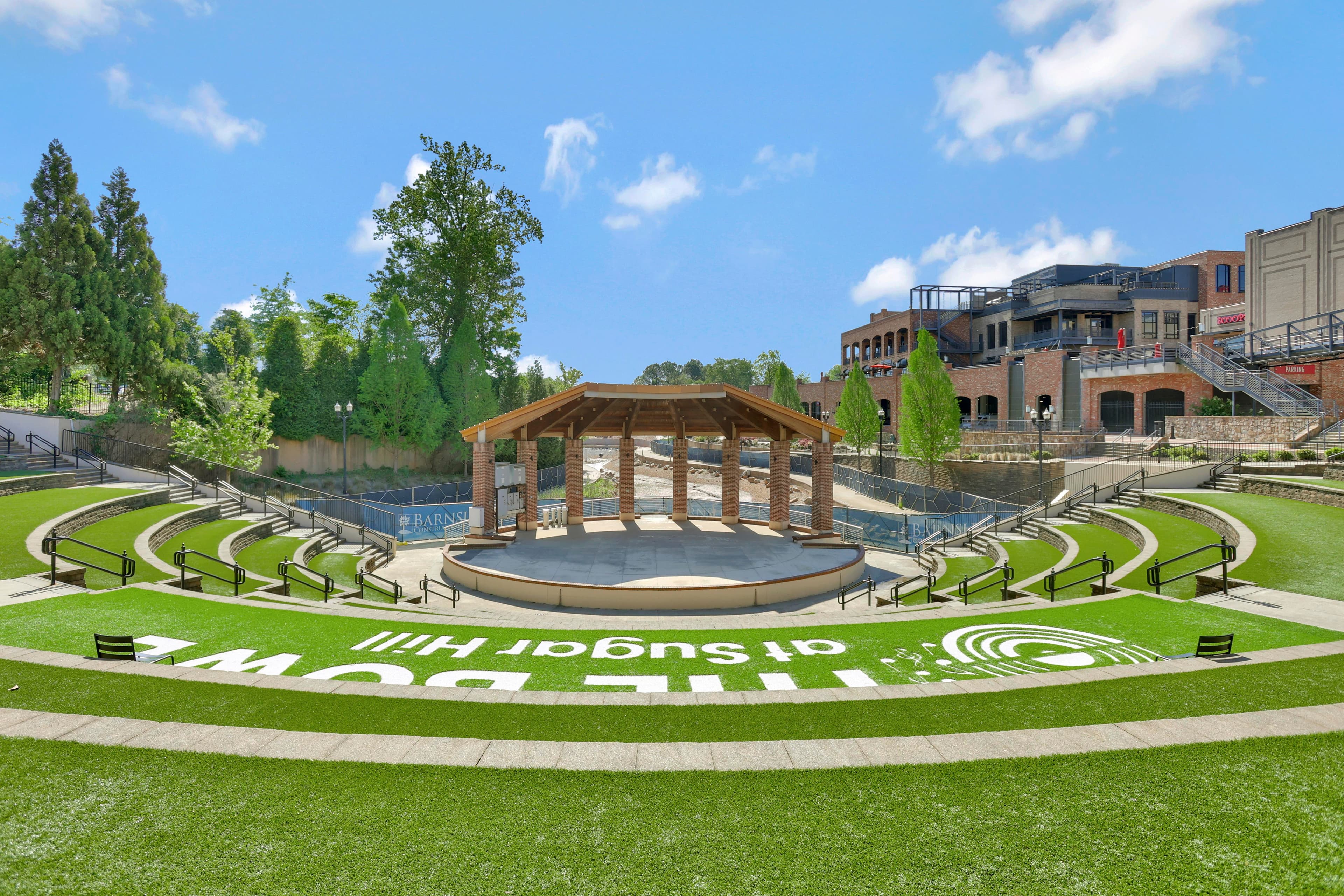 view of shops, restaurants, and amphitheater 