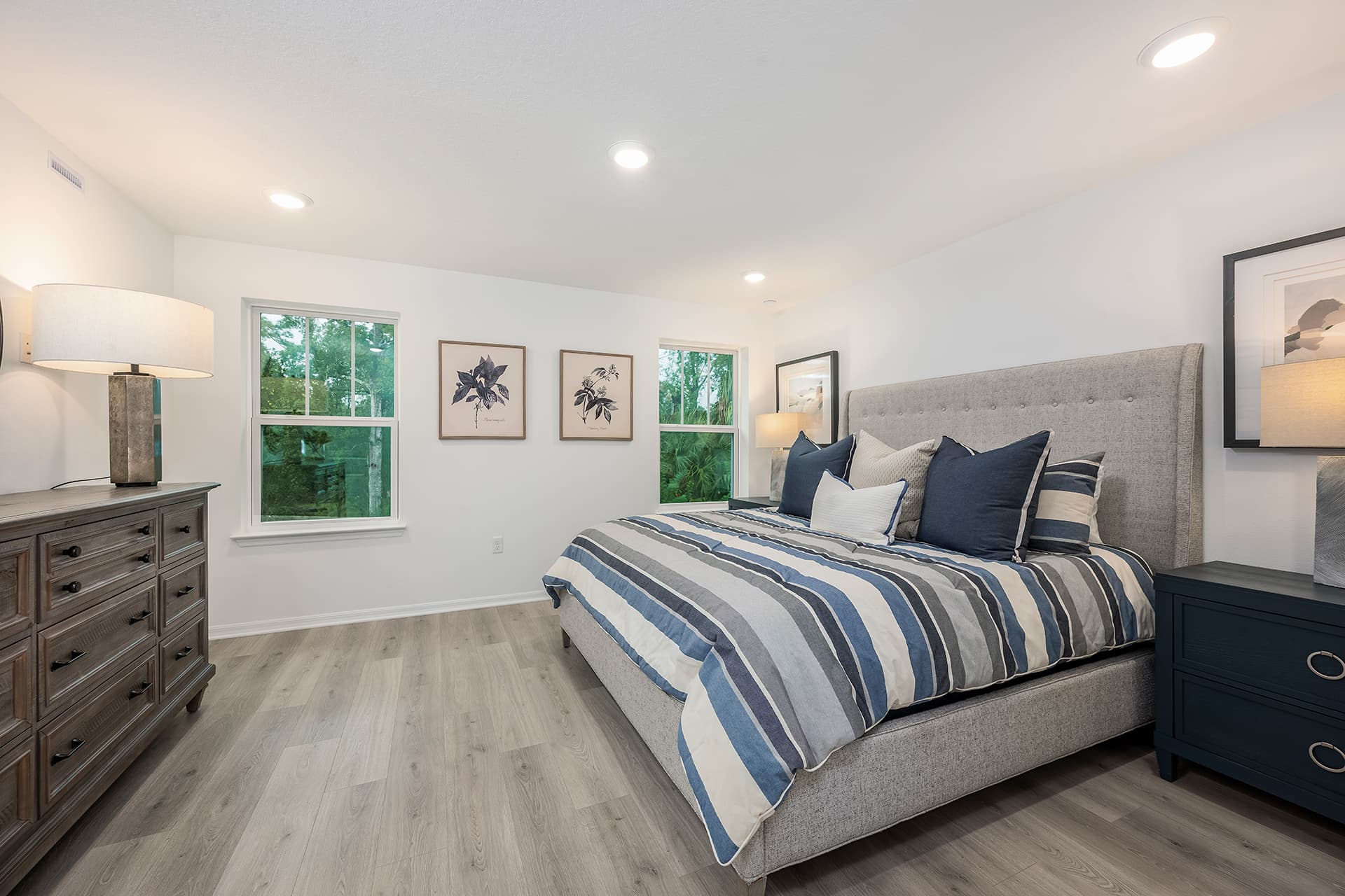 primary bedroom with king sized bed and two nightstands