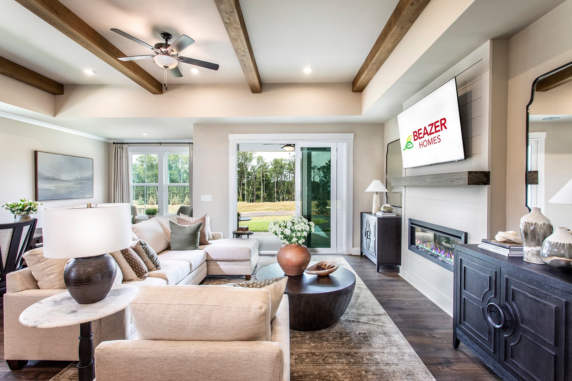 great room with electric fireplace & plank floors