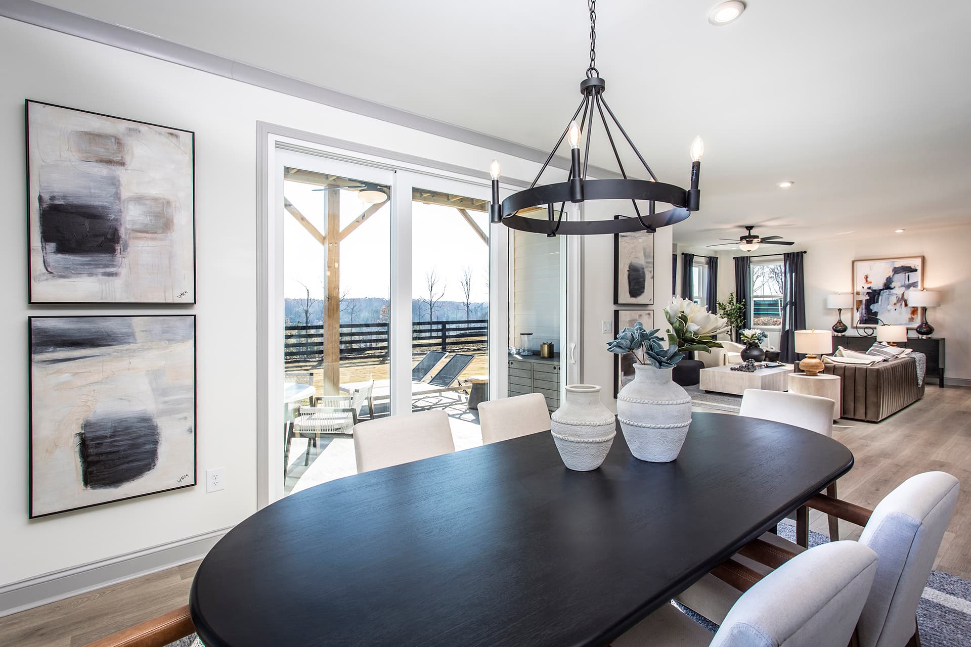 dining room with black table & windows