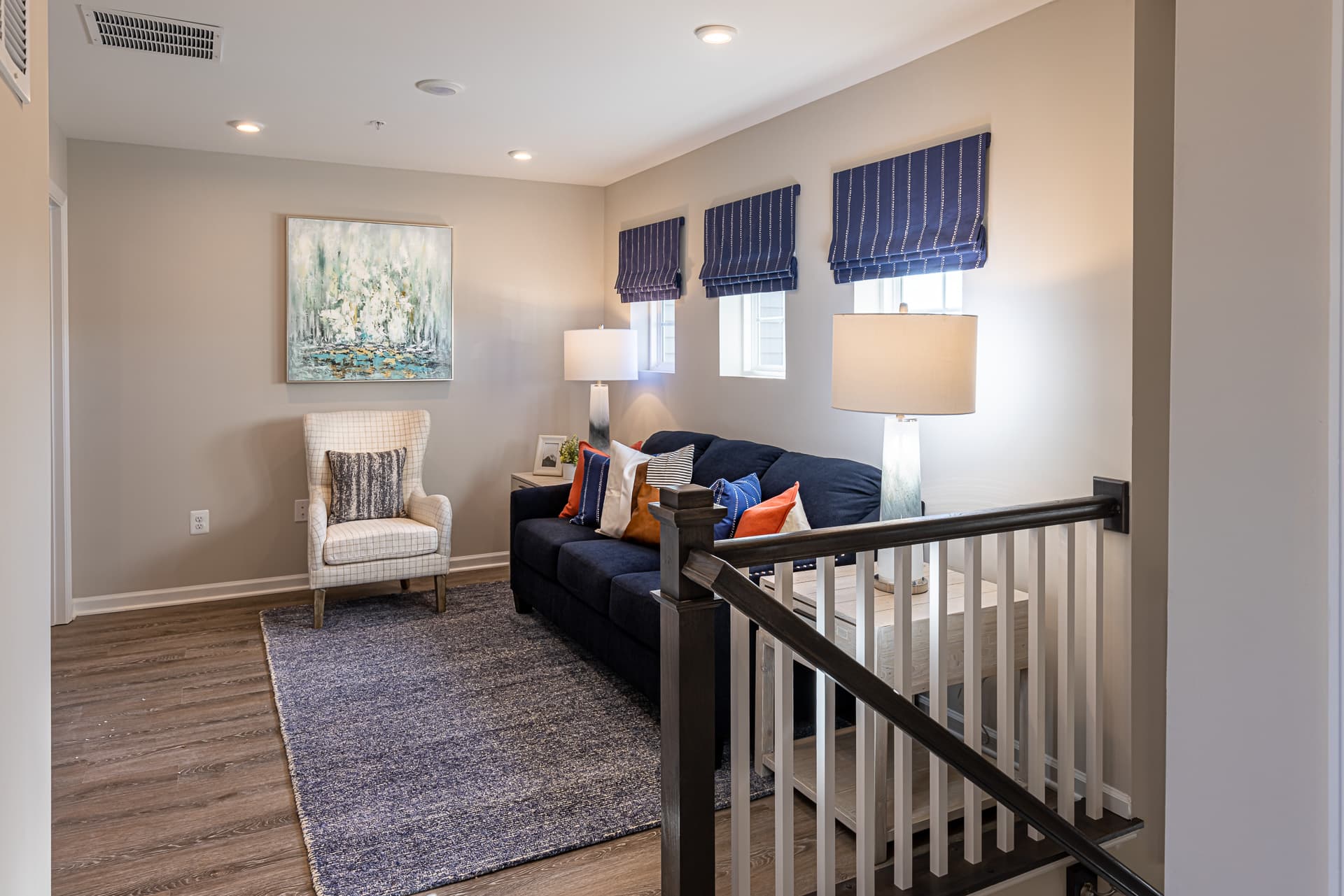 2nd-floor loft with a couch and small chair