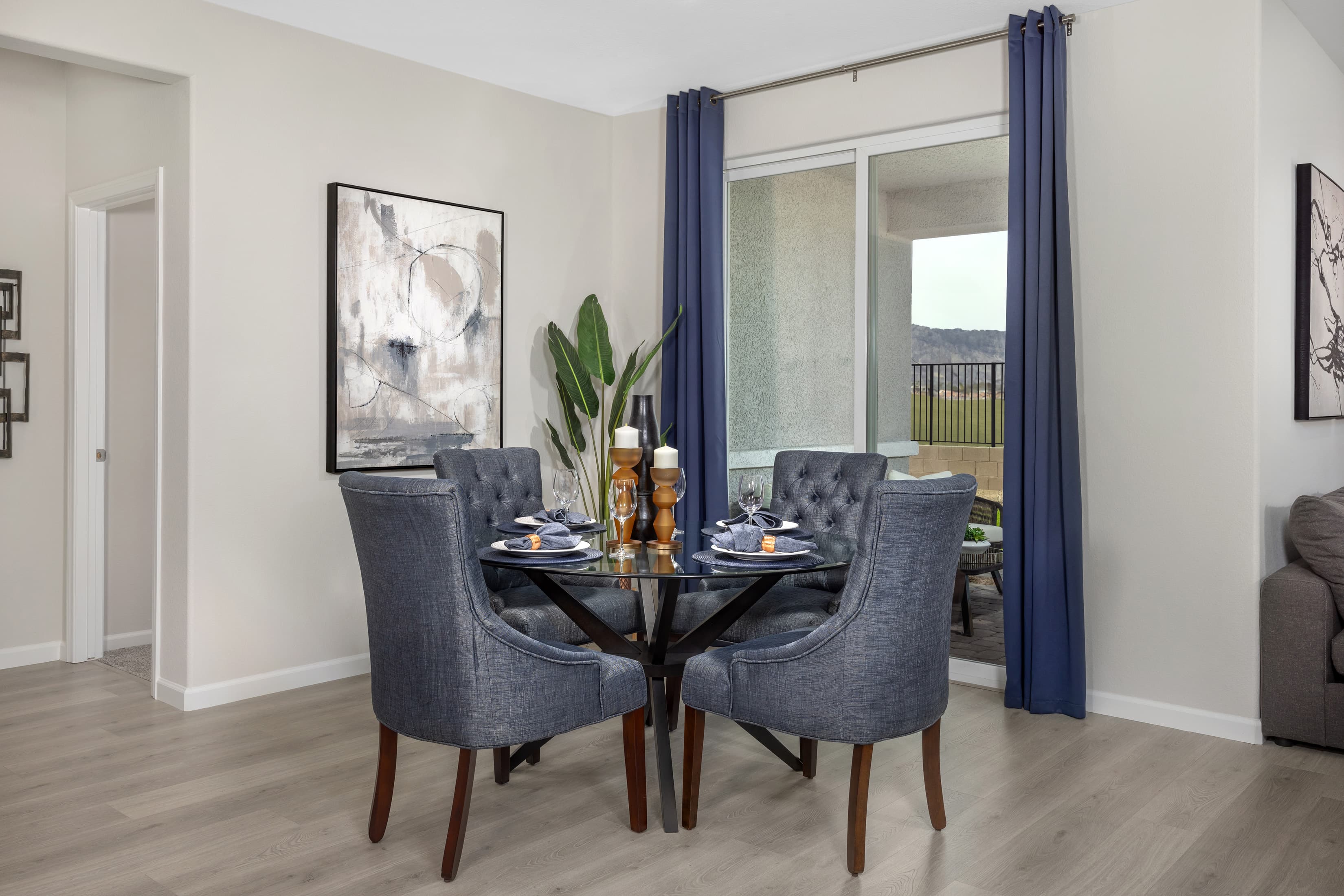 dining room with circular table and blue chairs