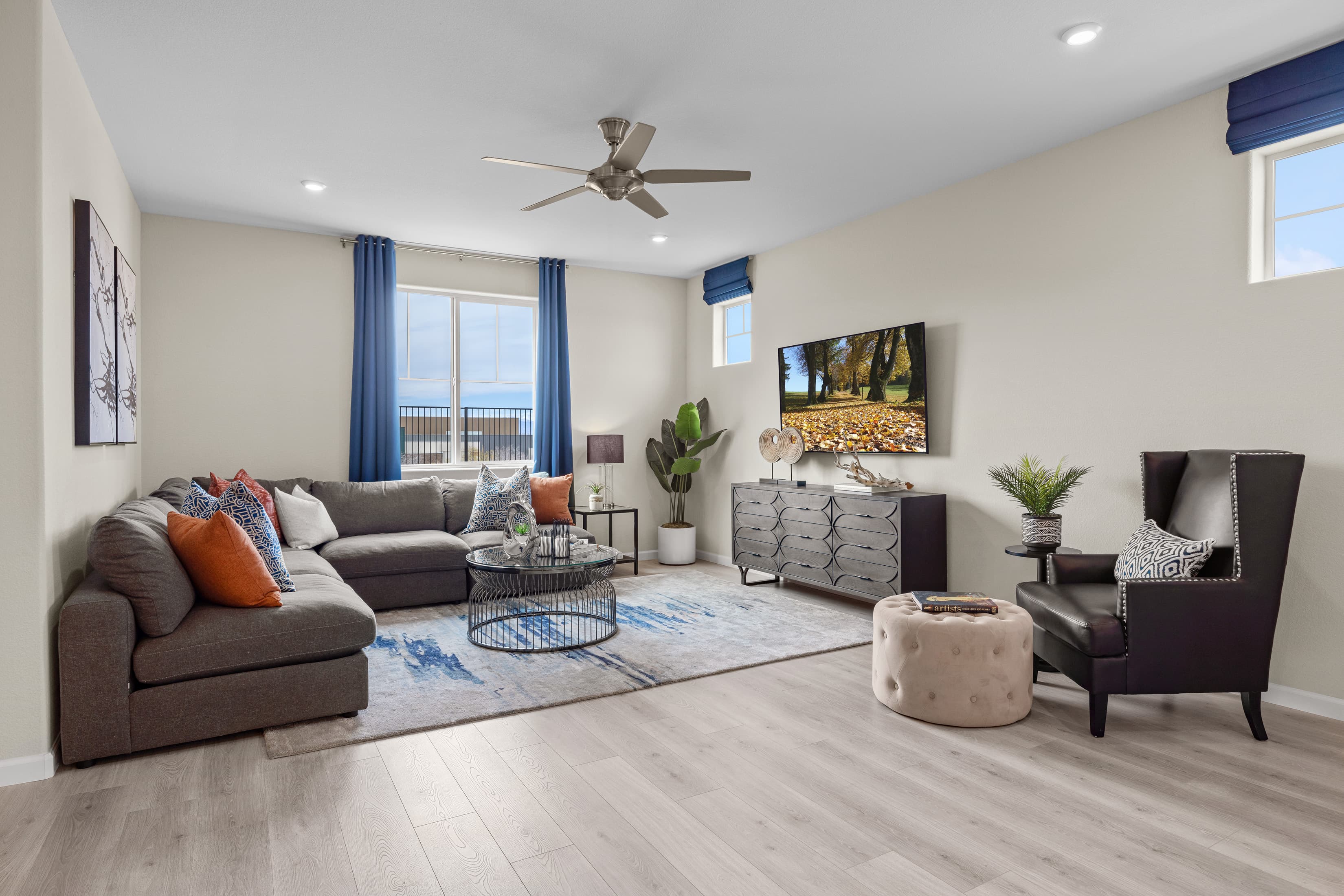 living room with furniture and upgraded tile
