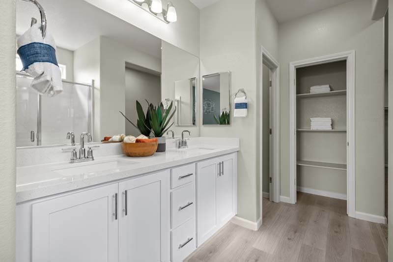 primary bathroom with dual sinks