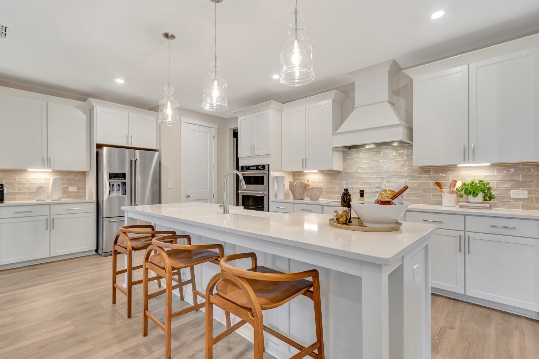 kitchen with island with a sink and barstools