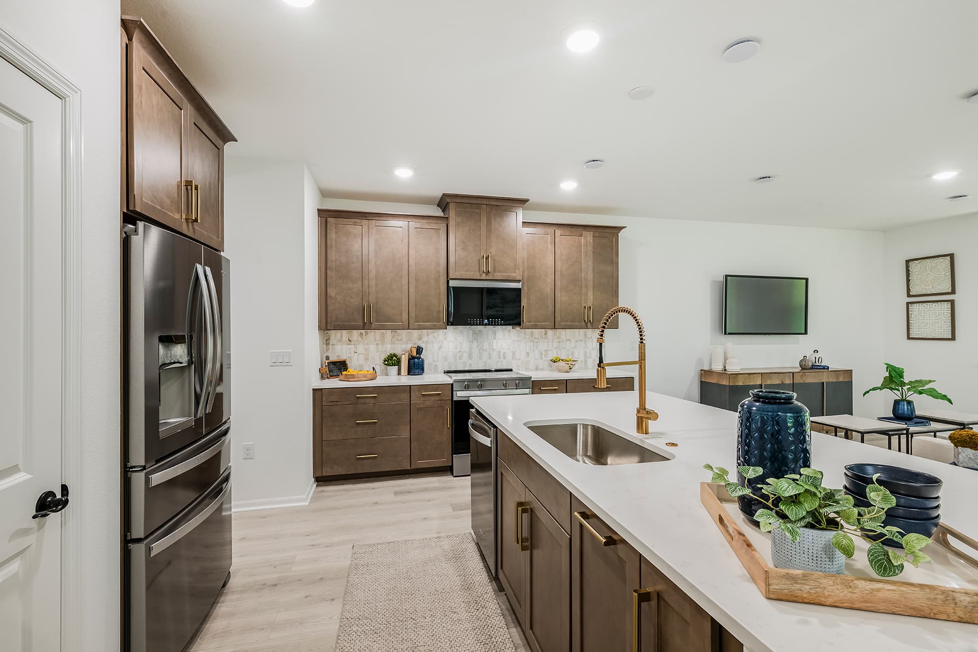 kitchen with brown cabinets and quartz countertops