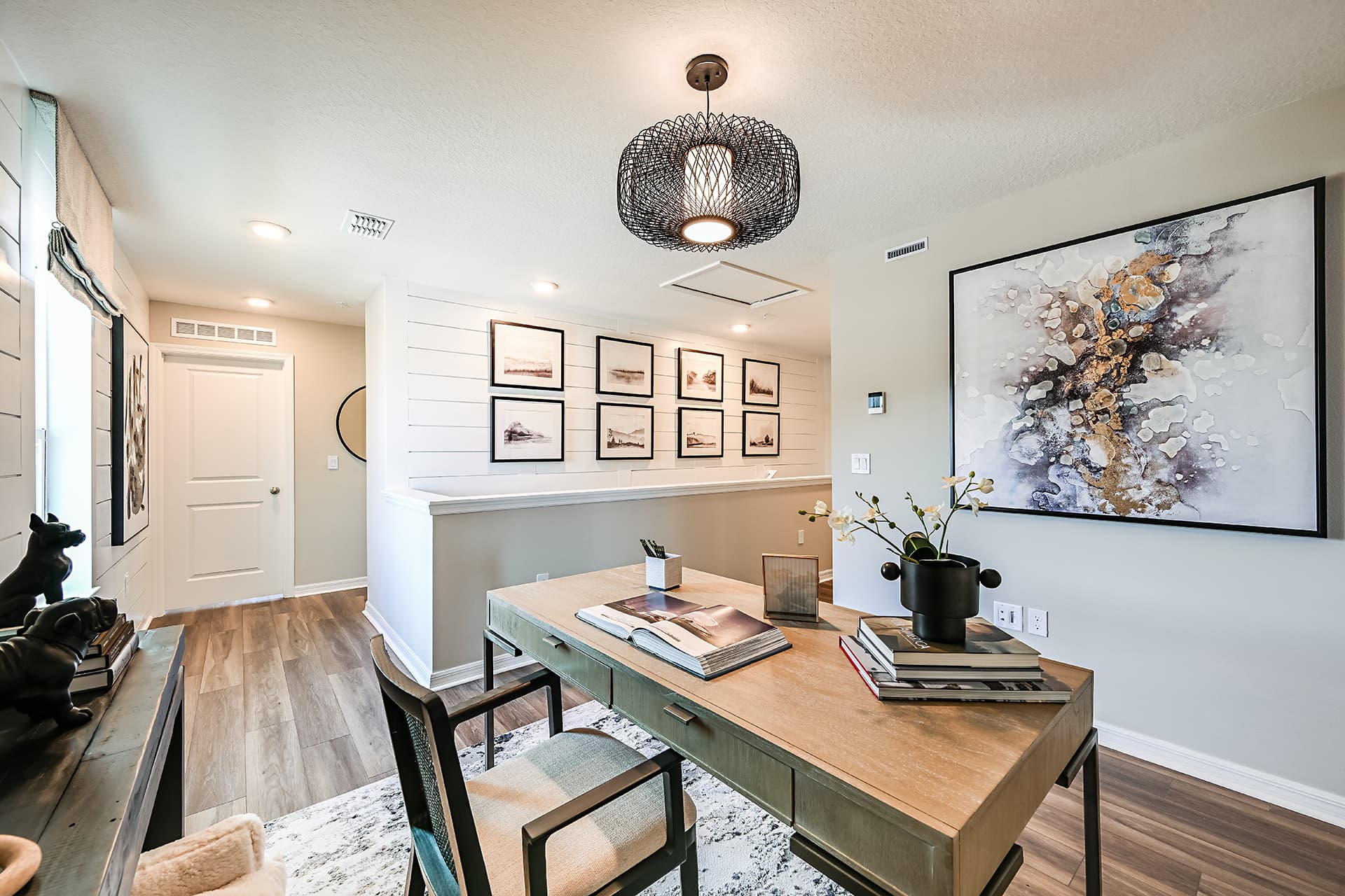 loft with desk setup and wall art