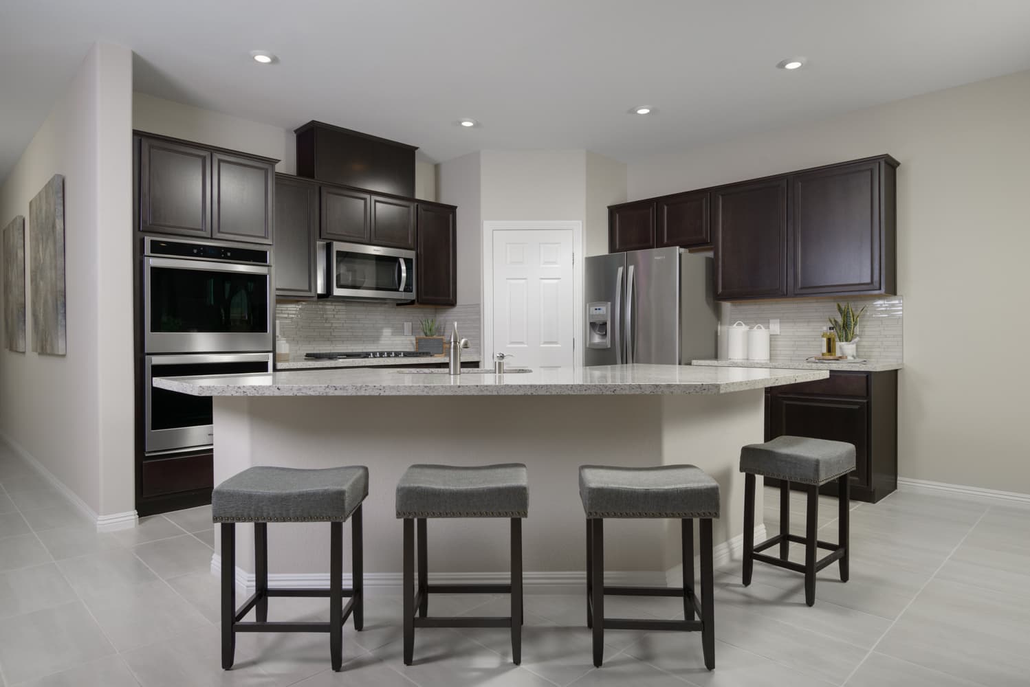 kitchen with stainless appliances & dark cabinets
