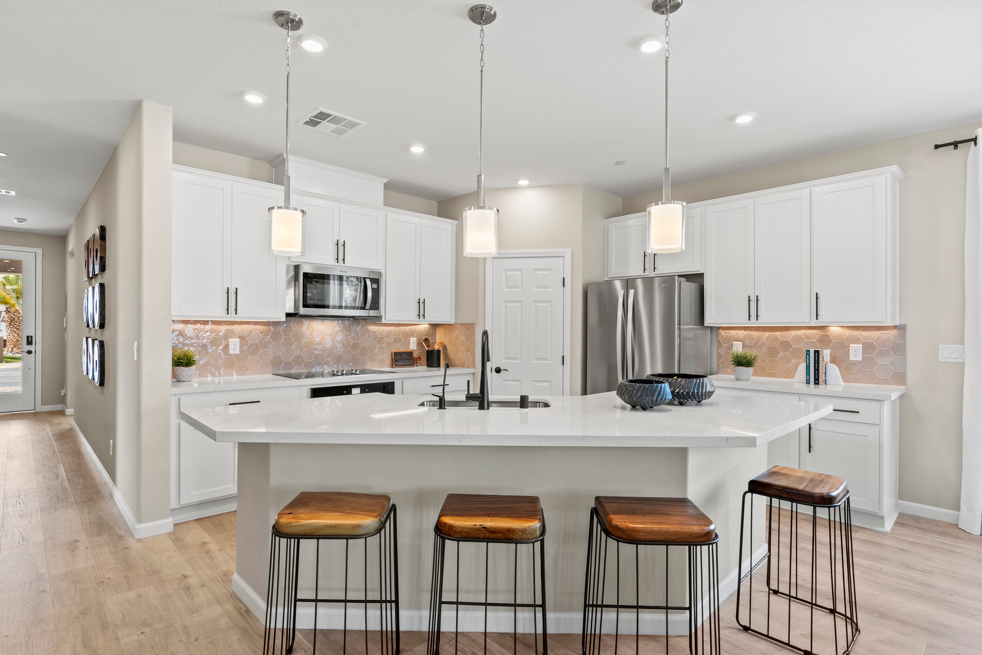 bright and open kitchen with white cabinets