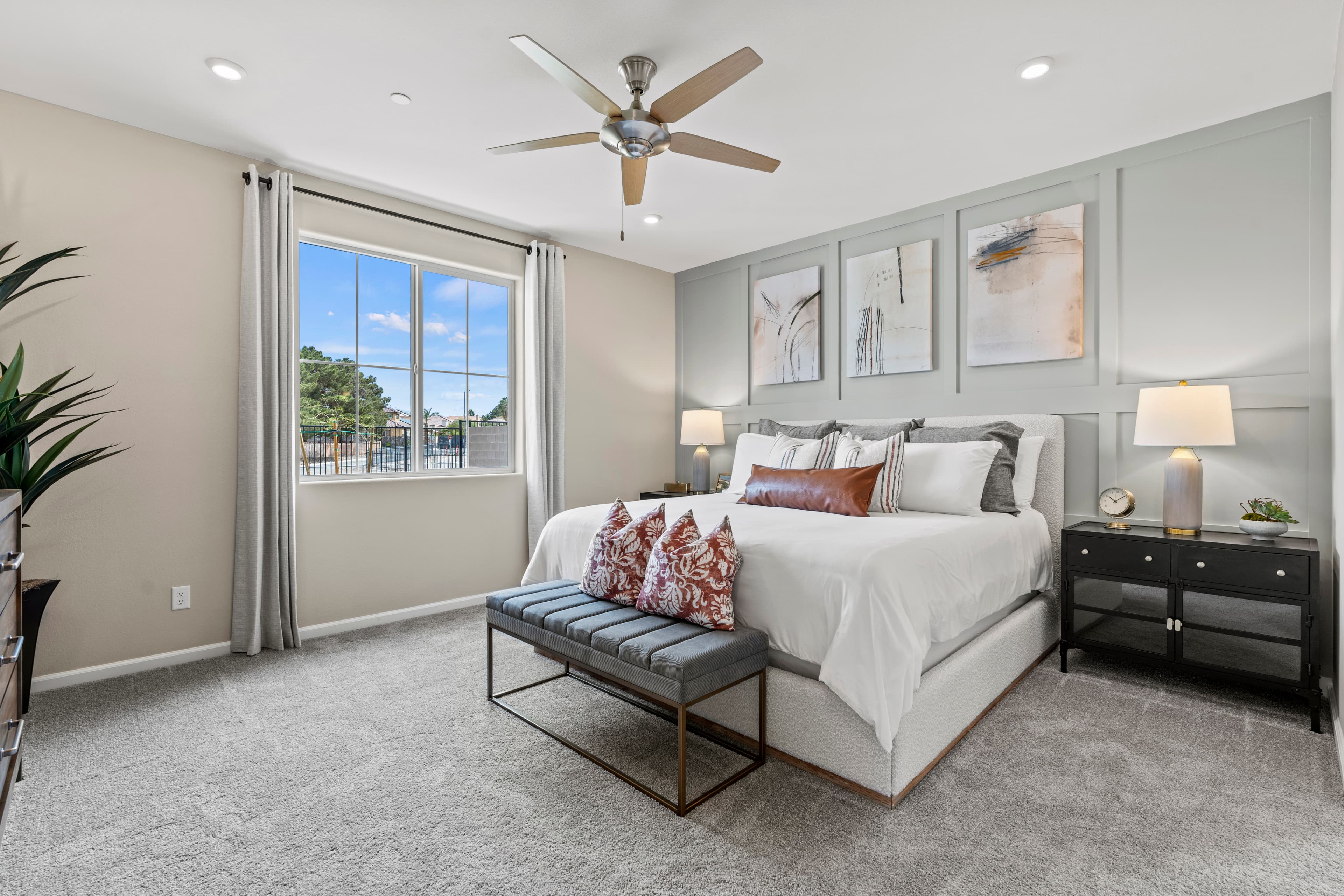 bright furnished bedroom with accent wall