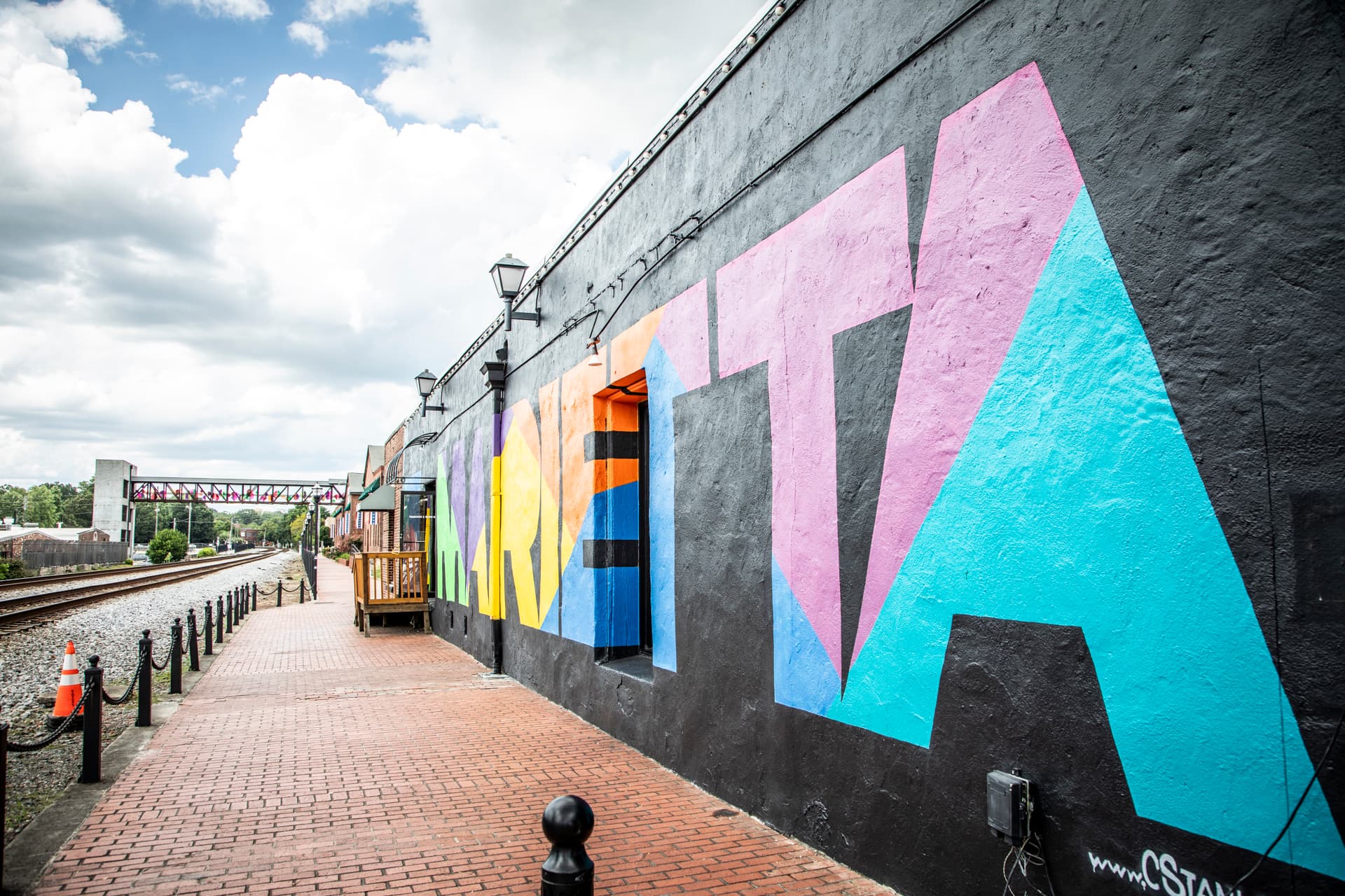 marietta square with wall mural by train tracks