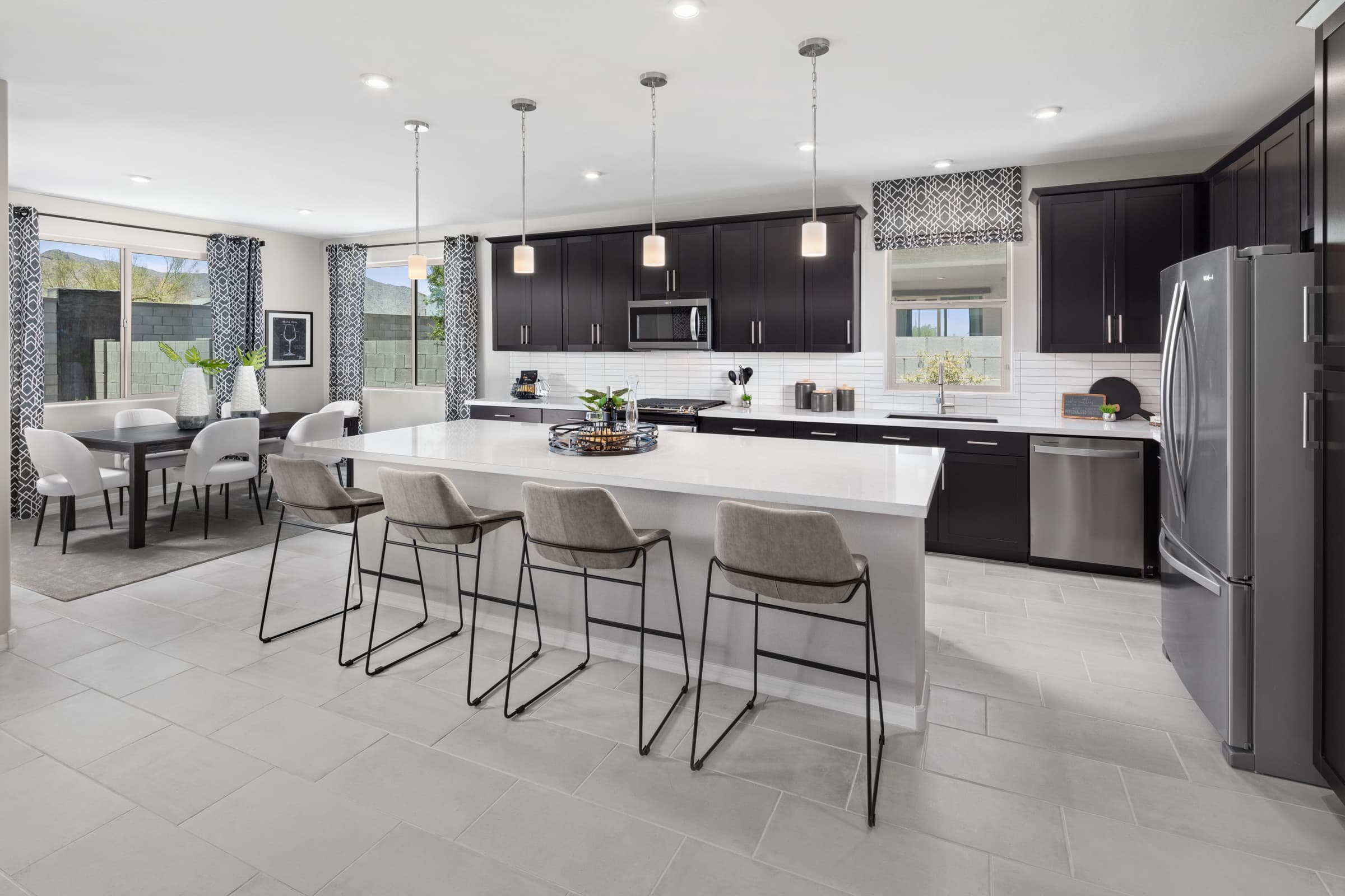open-concept kitchen with dark cabinets