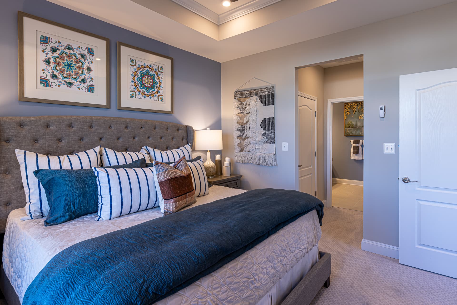 1st-floor primary suite with a blue accent wall