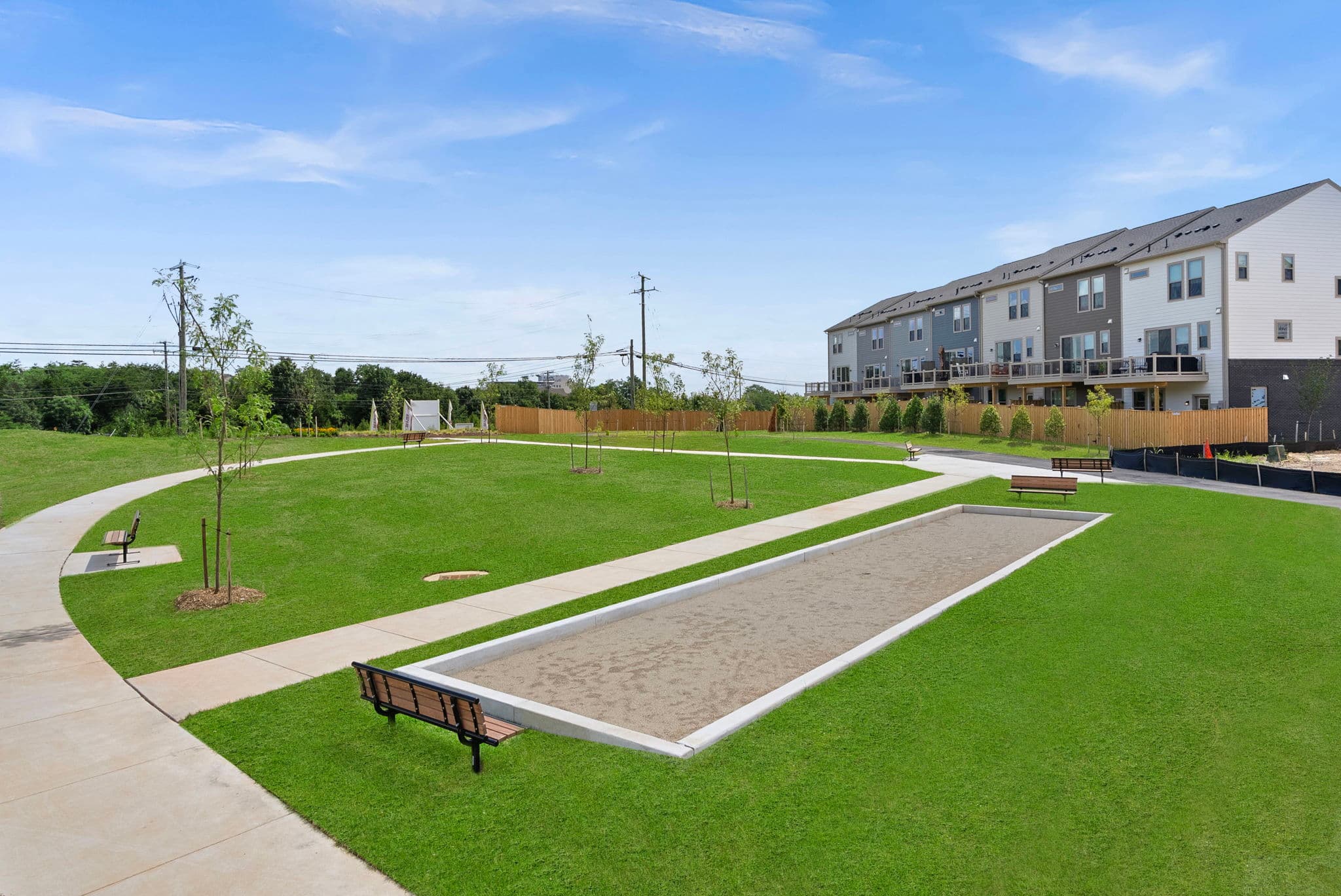 bocceball set with benches and grass surrounding