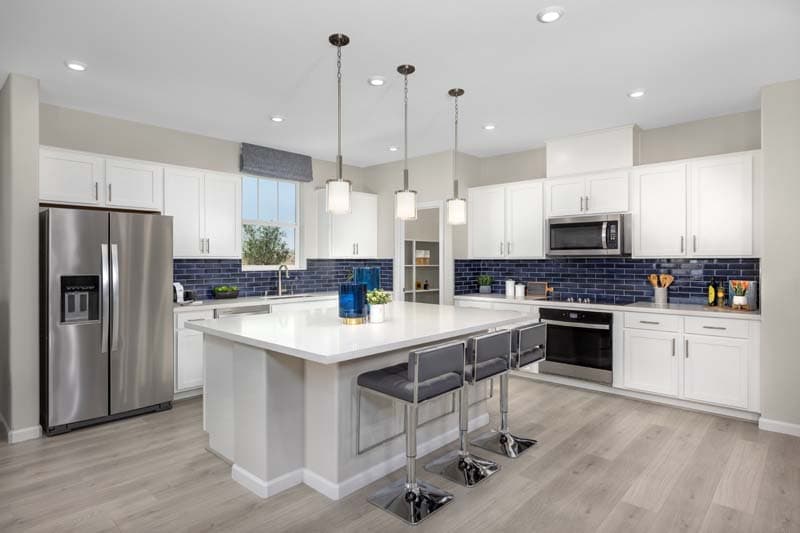 kitchen with stainless appliances & white cabinets