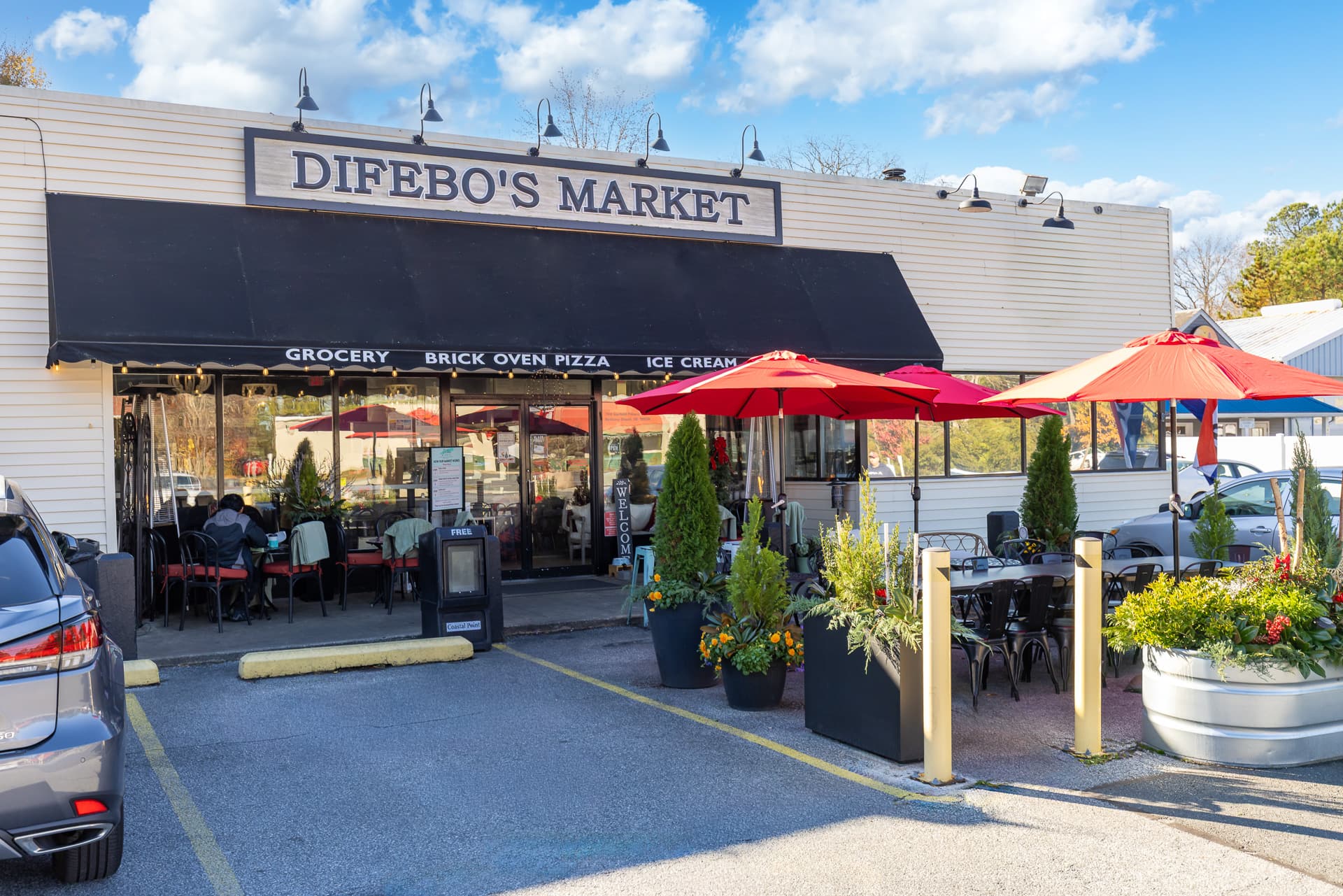 local shop offering groceries and brick oven pizza