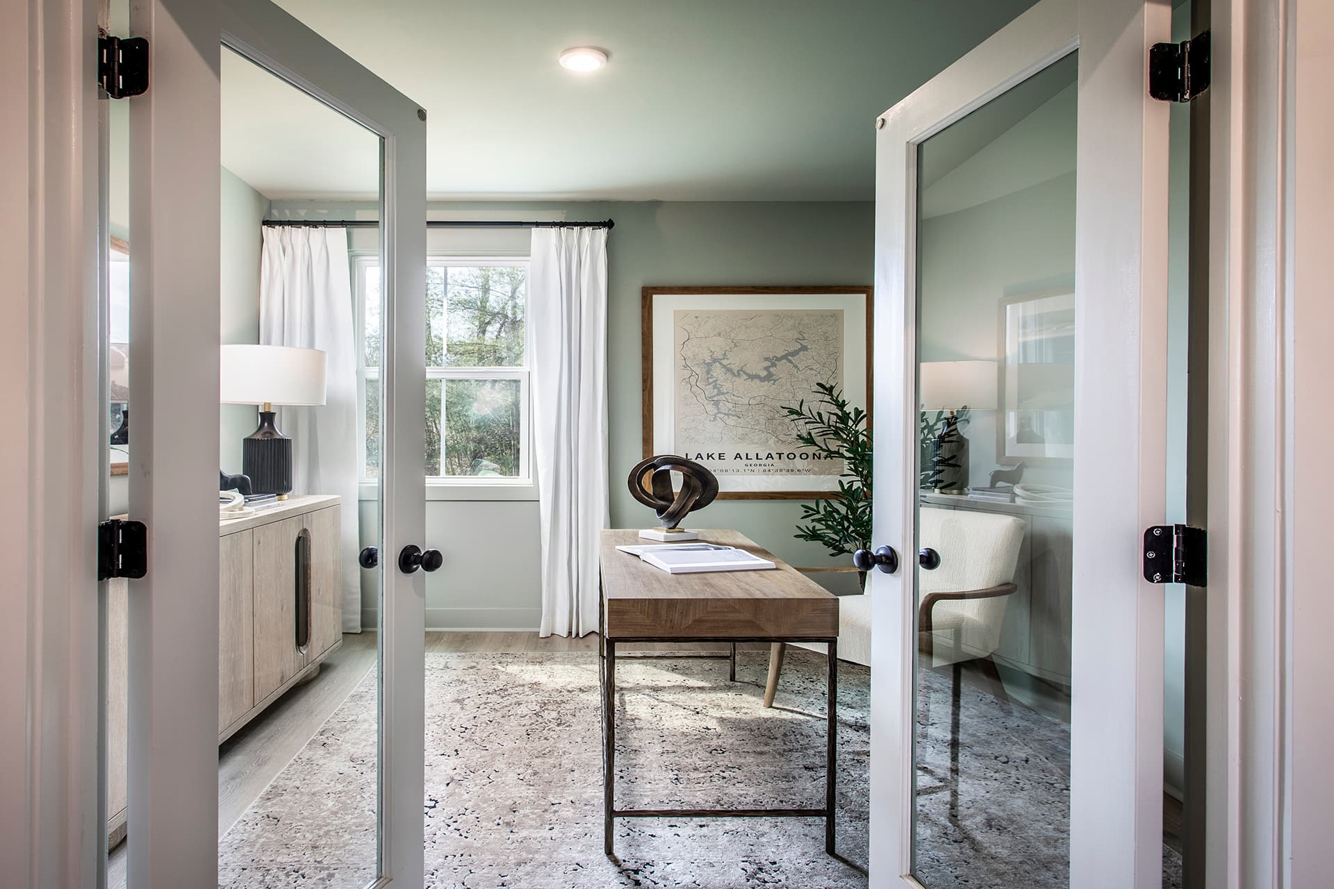study with french doors and office space