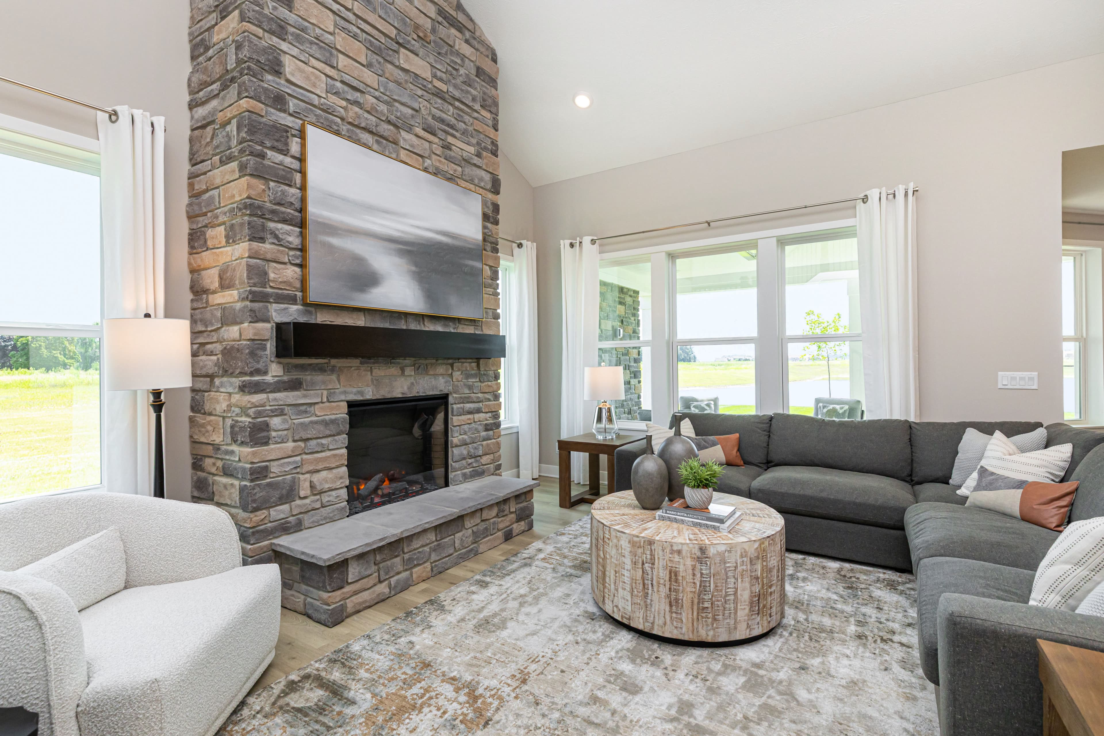 great room with stone fireplace