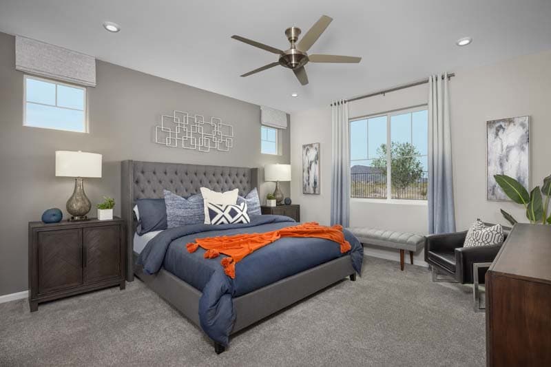 primary bedroom with bed, carpet, and large window