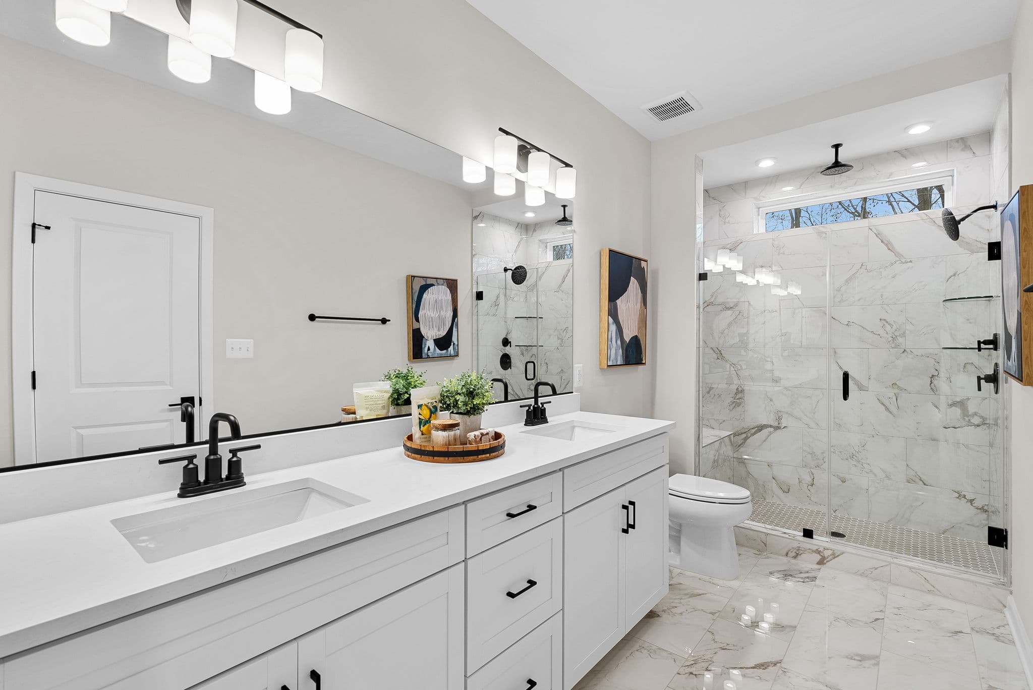 bathroom with quartz countertops & white cabinets