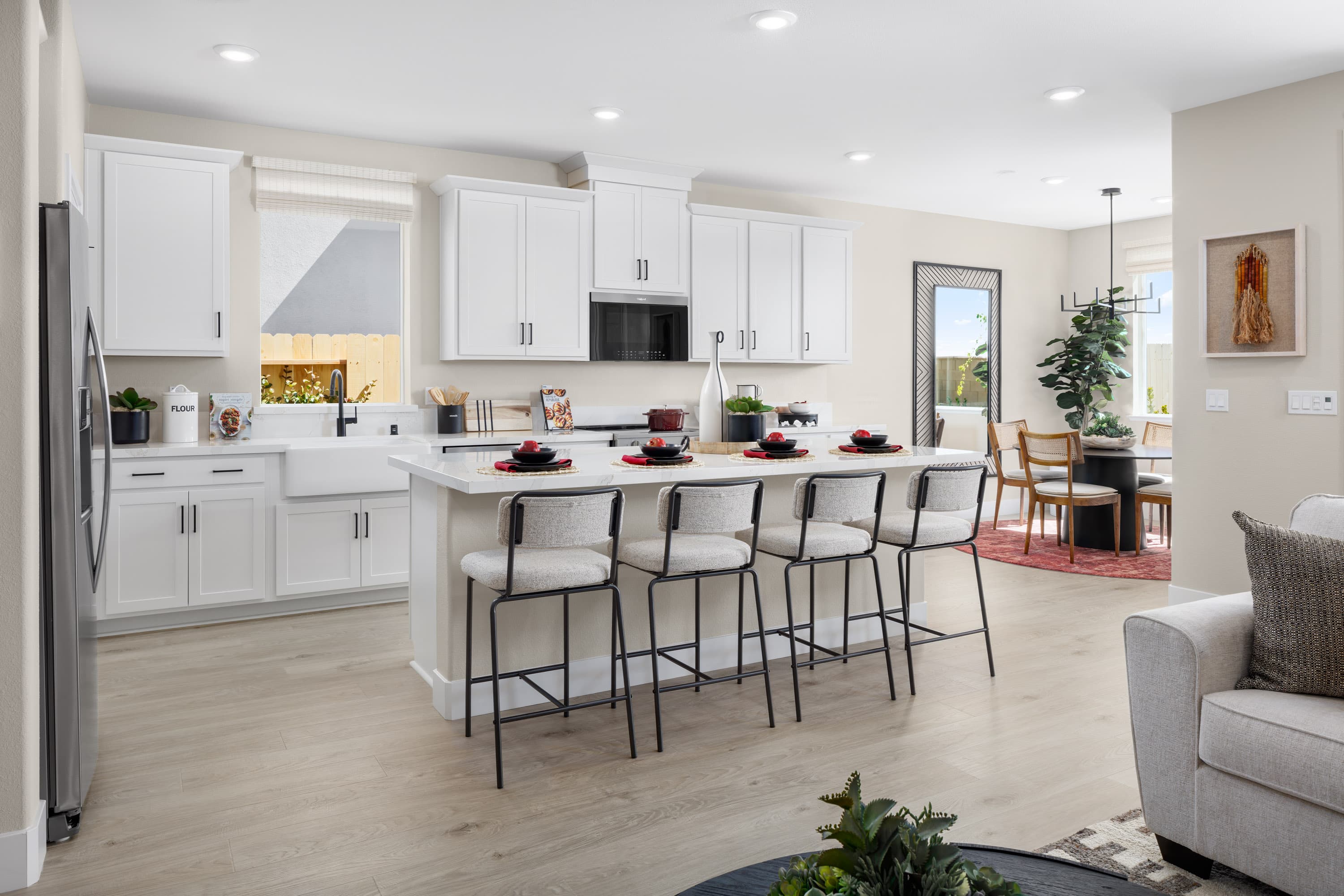 kitchen with white cabinets and wood floors