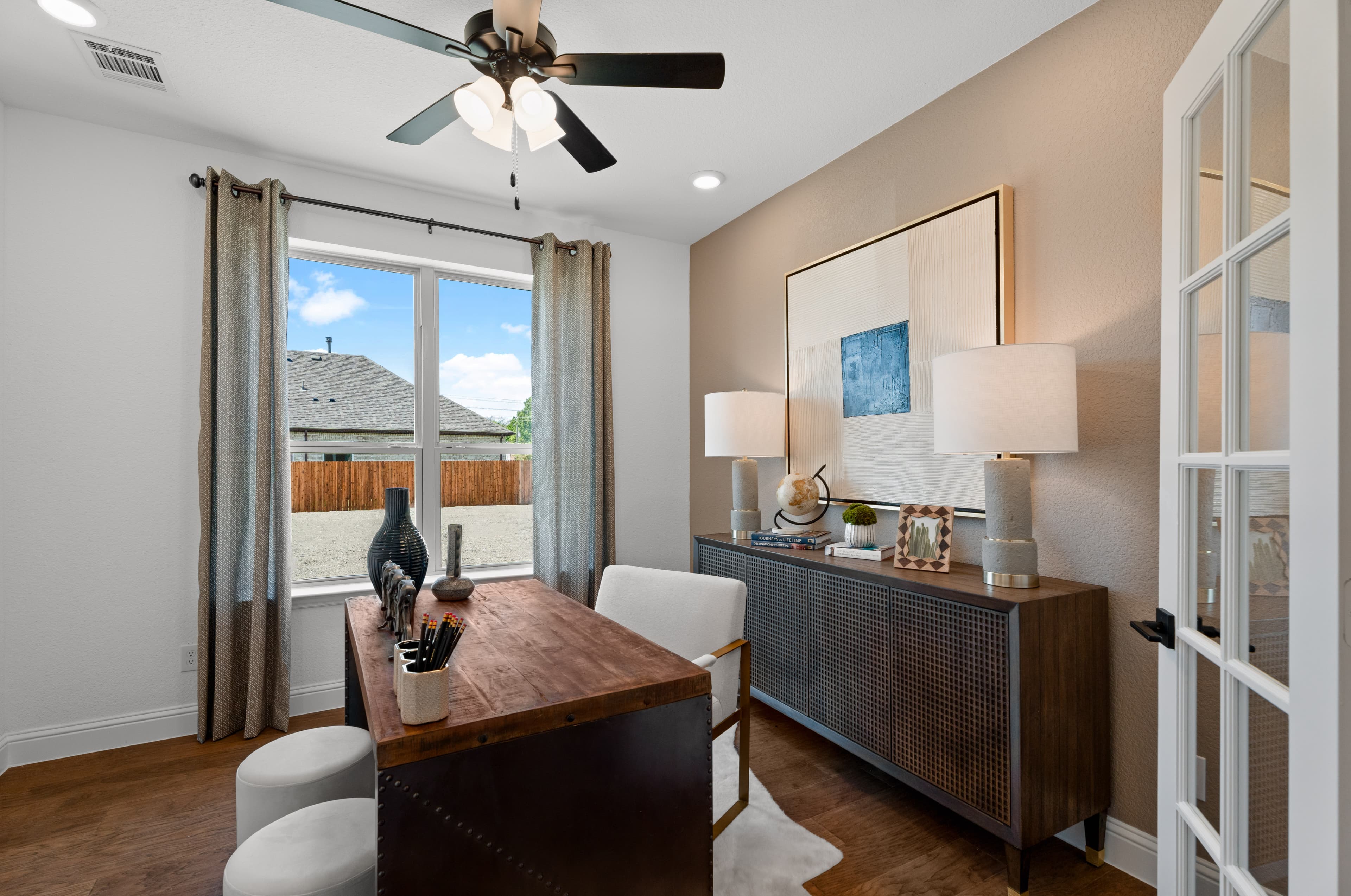 private study with french door and wooden desk