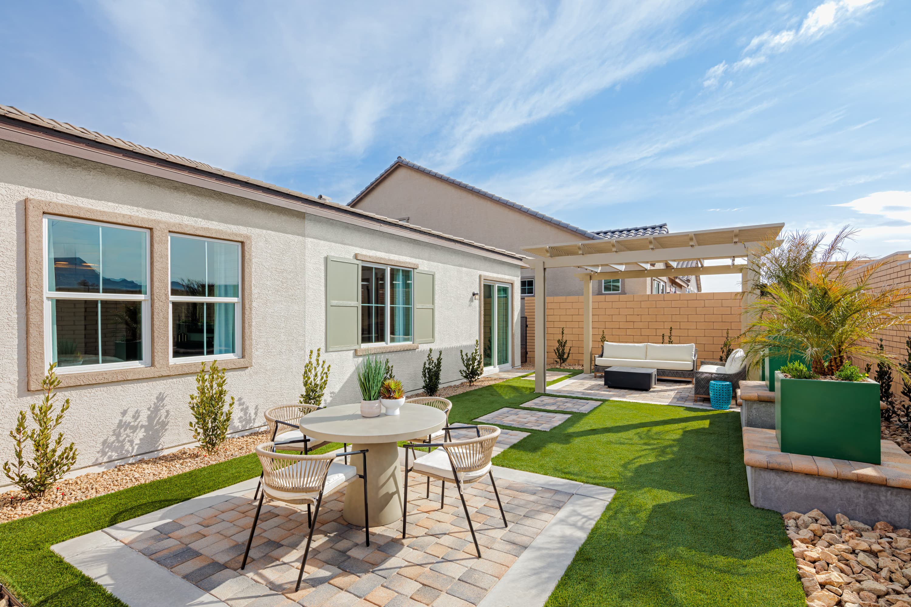 backyard with pavers and patio table
