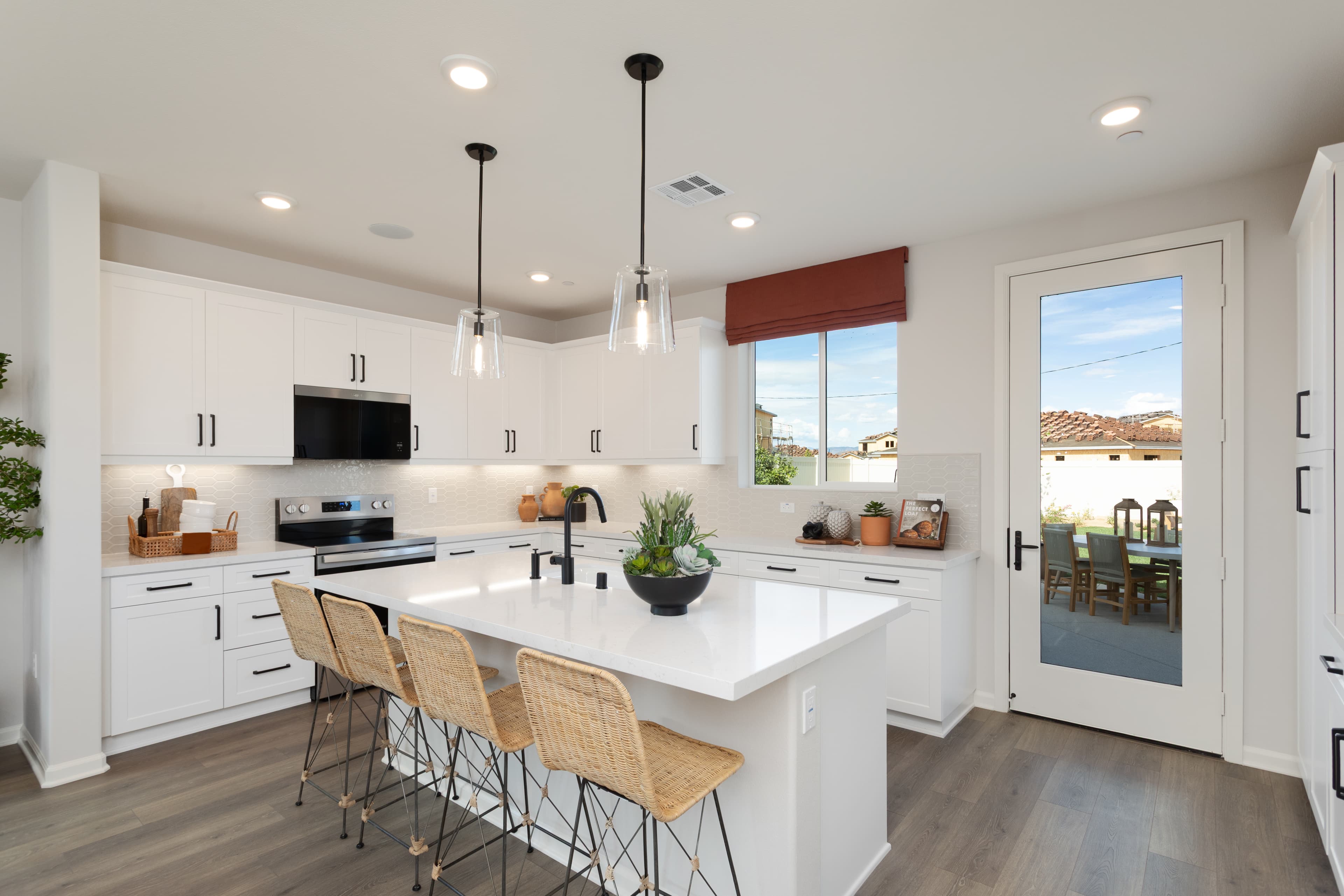 kitchen with white cabinets and countertops