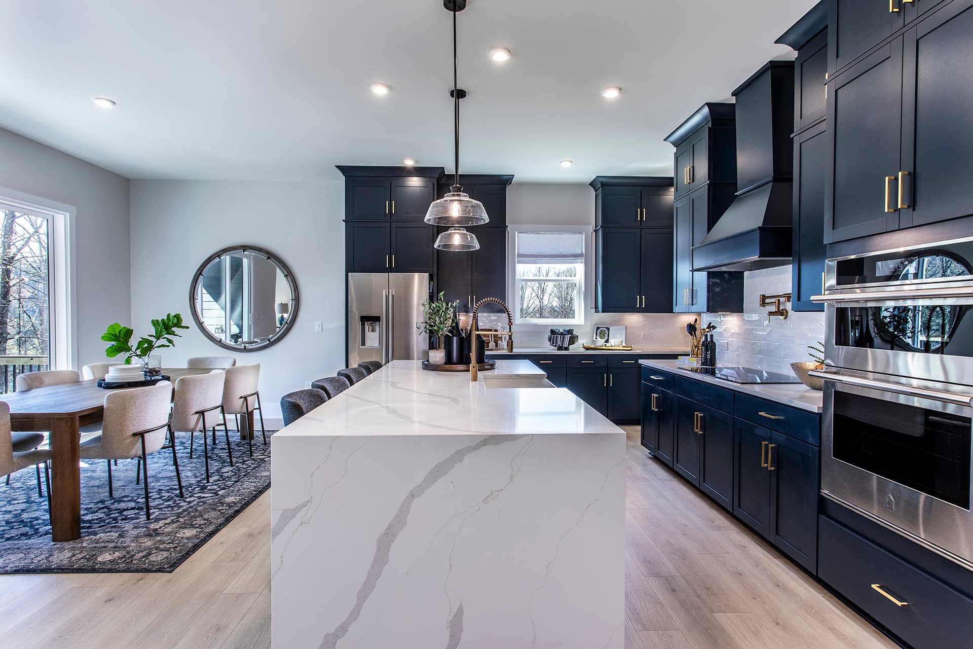 kitchen with navy cabinets and waterfall island