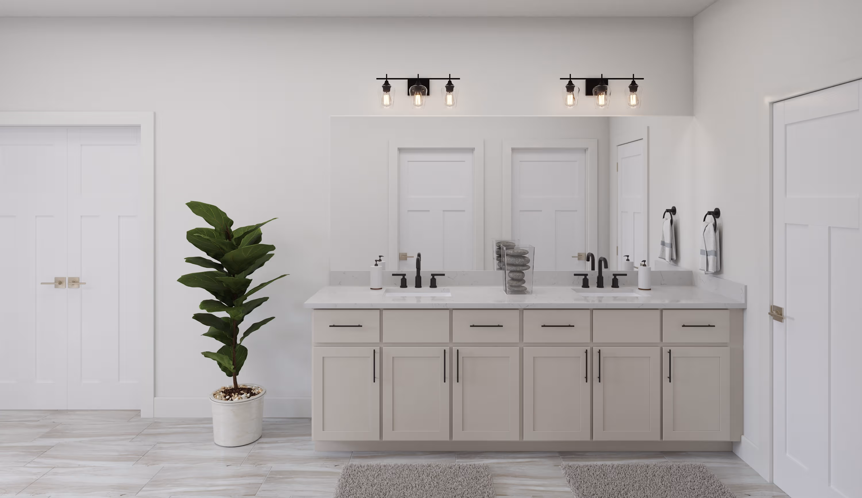 primary bathroom with dual vanities and mirror