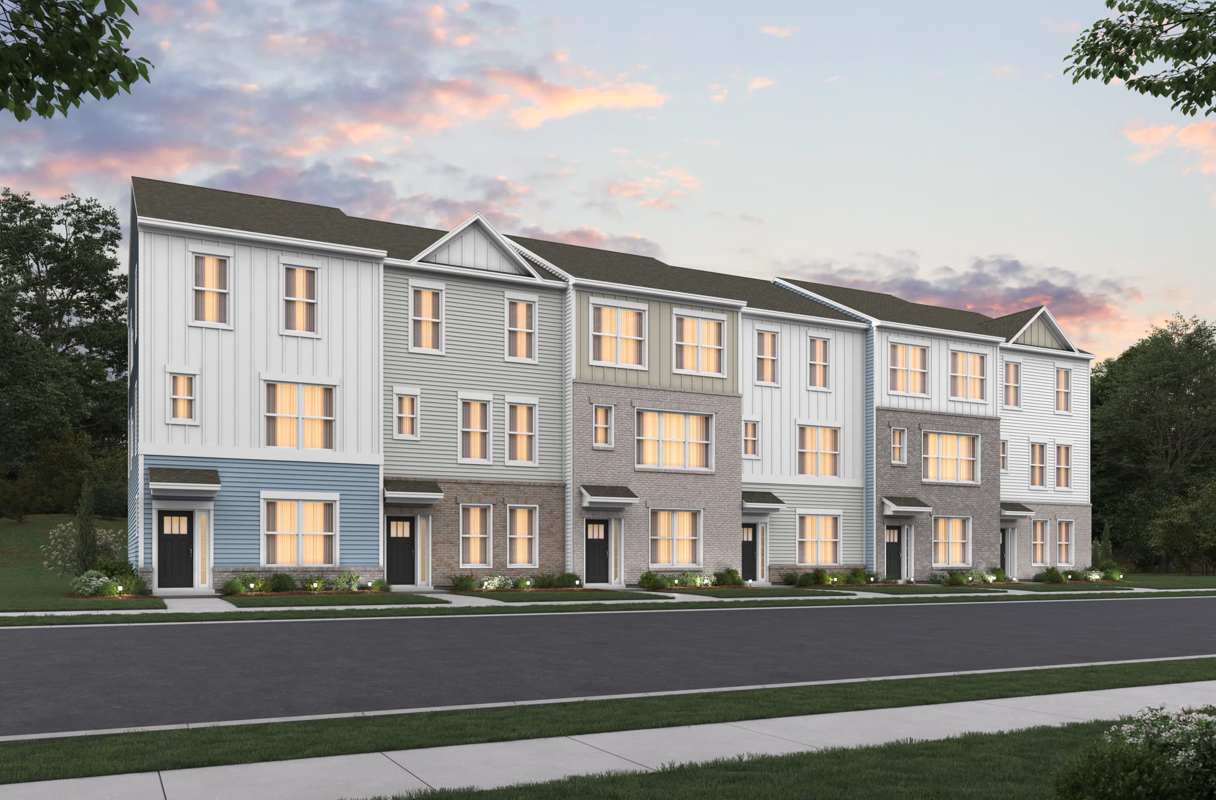 rendering of townhomes with sunset and grass around it