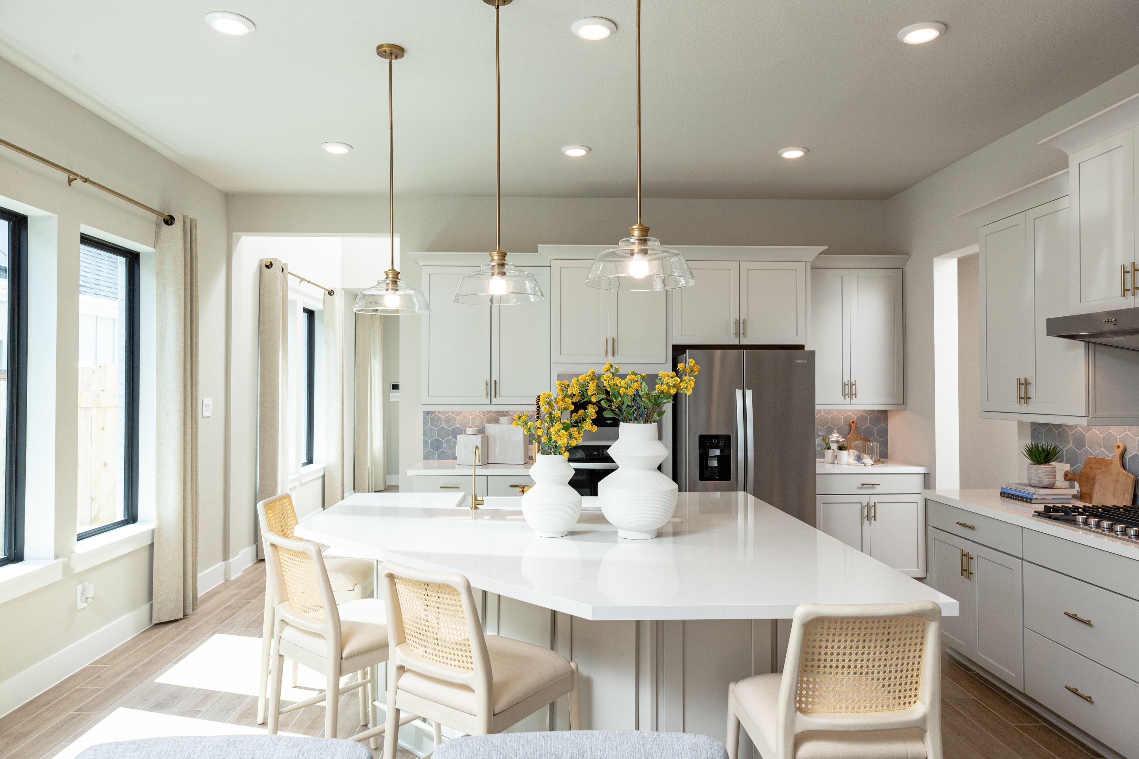 open kitchen with beige cabinets and large island