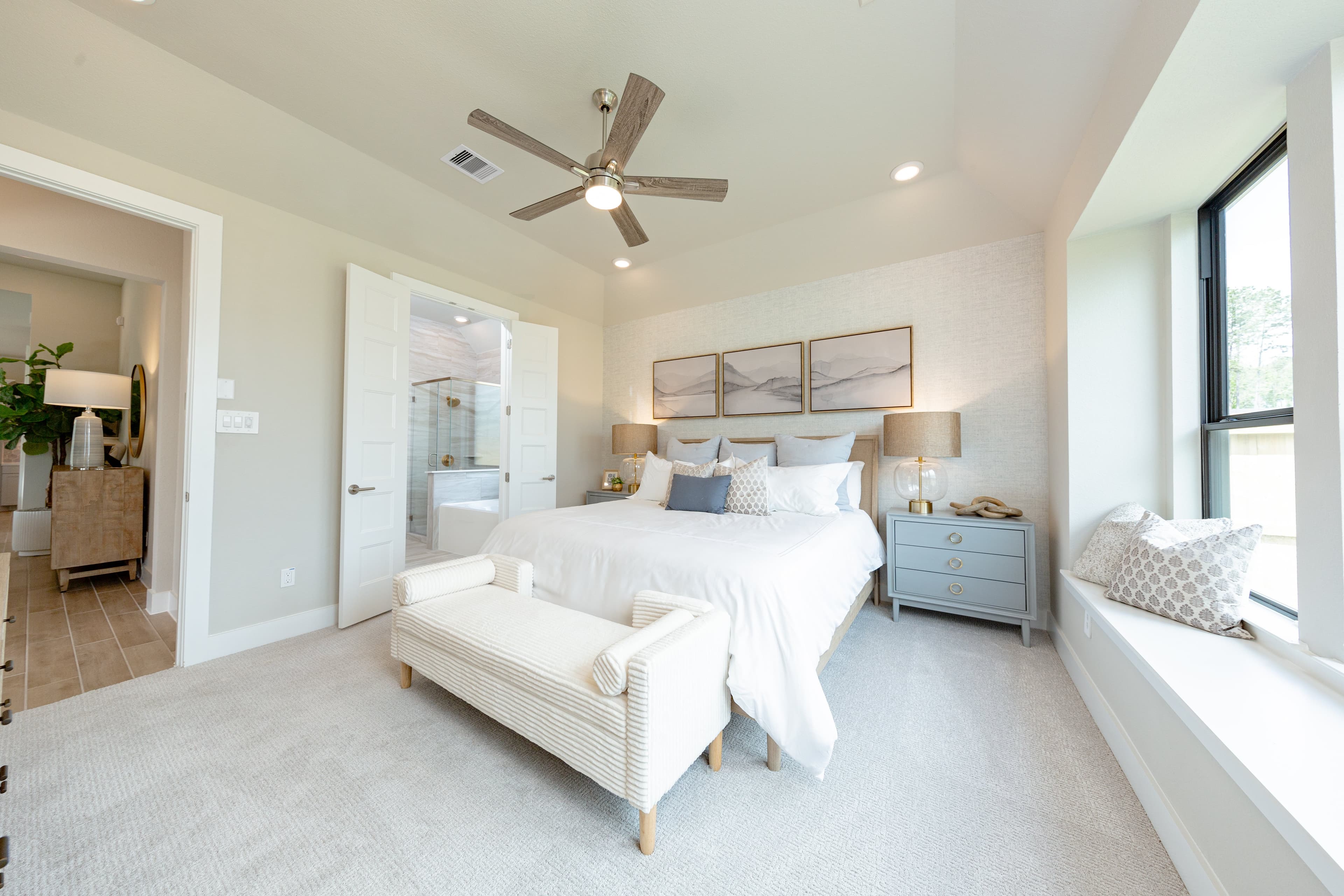 primary bedroom with high ceilings and carpet