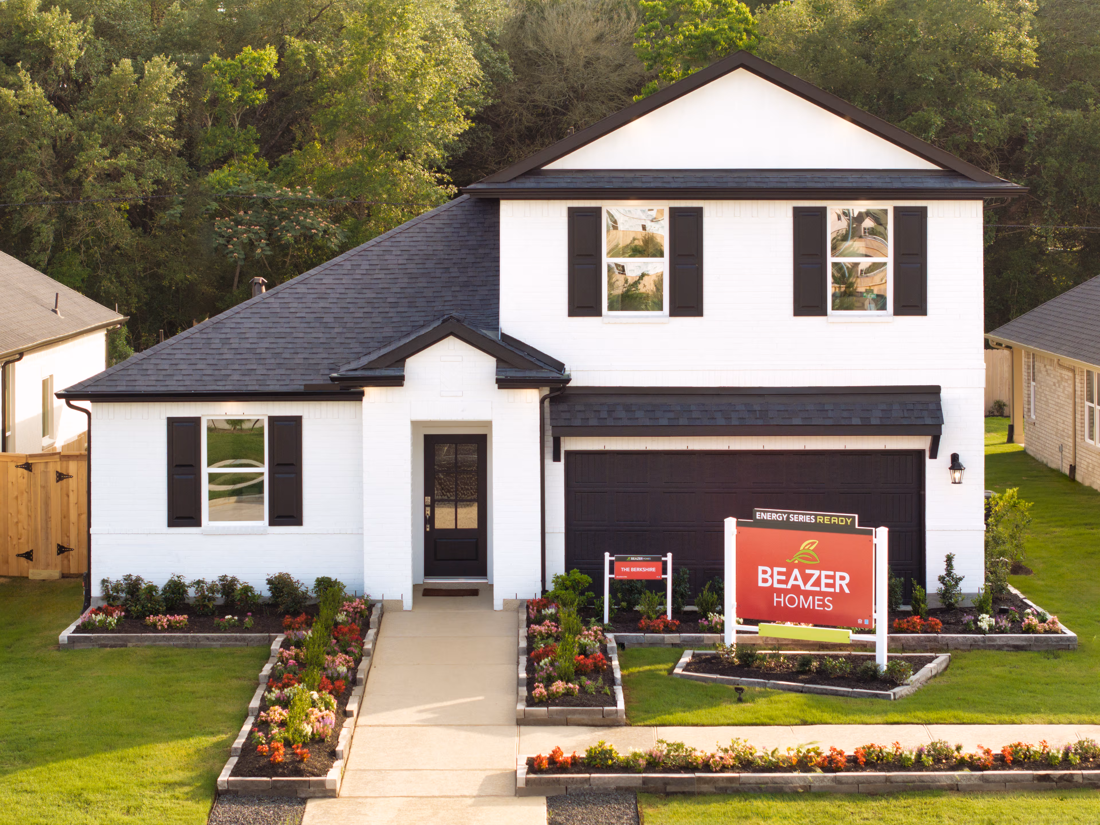 exterior of home with white brick and black siding