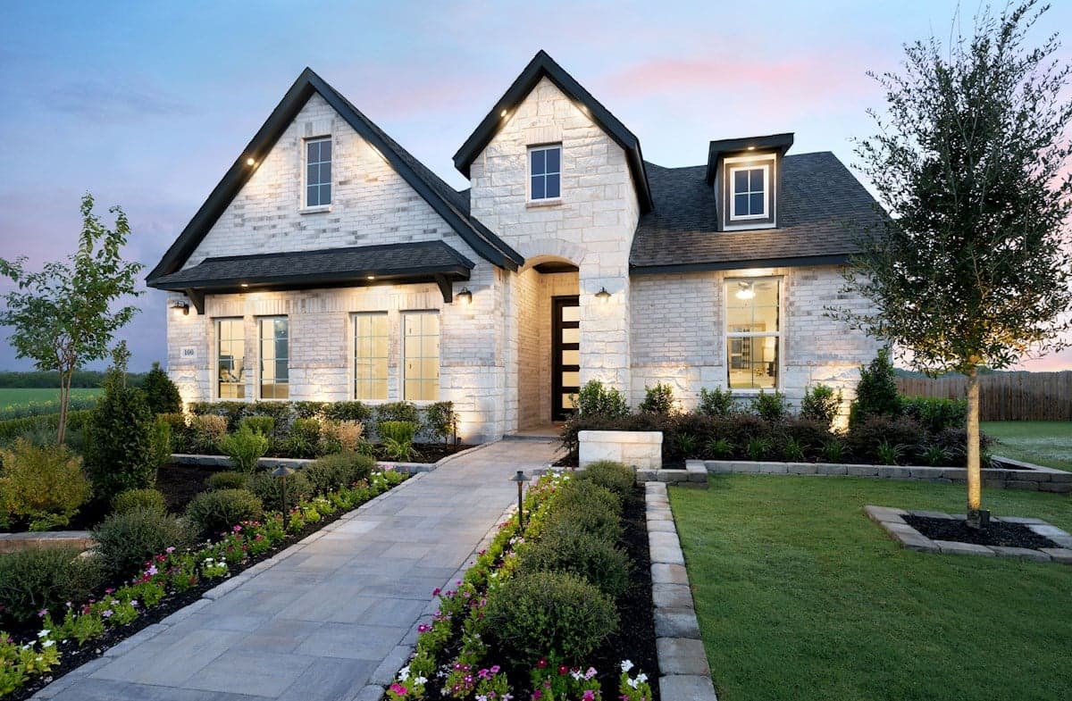exterior with brick, stone & a covered porch