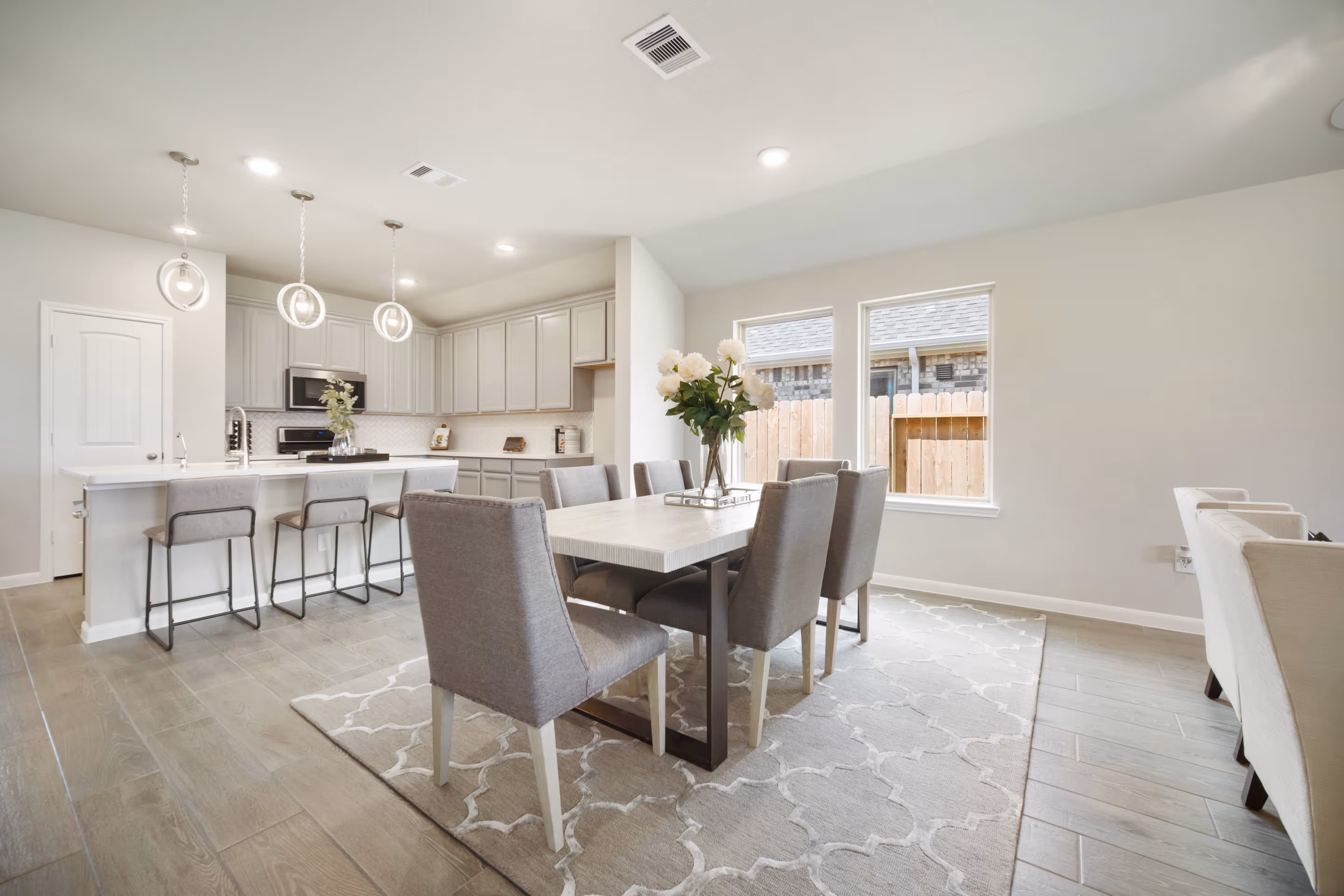 open kitchen and dining area with hardwood flooring