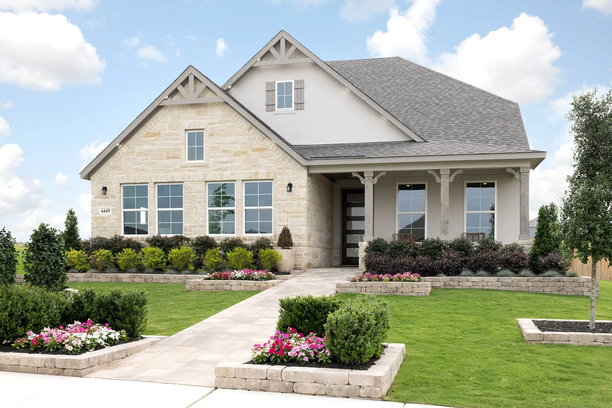 home with brick and landscaping